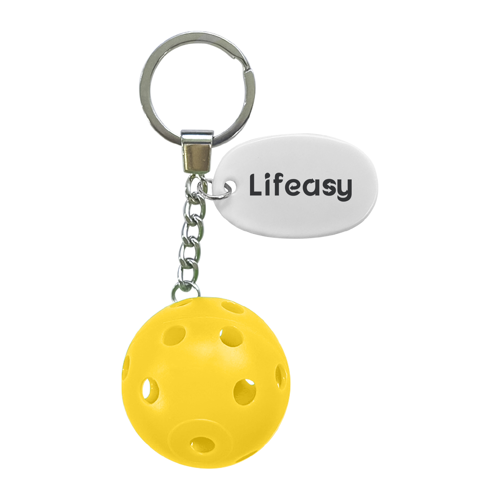 Yellow pickleball keychain featuring a miniature plastic pickleball attached to a durable metal keyring for everyday carry.