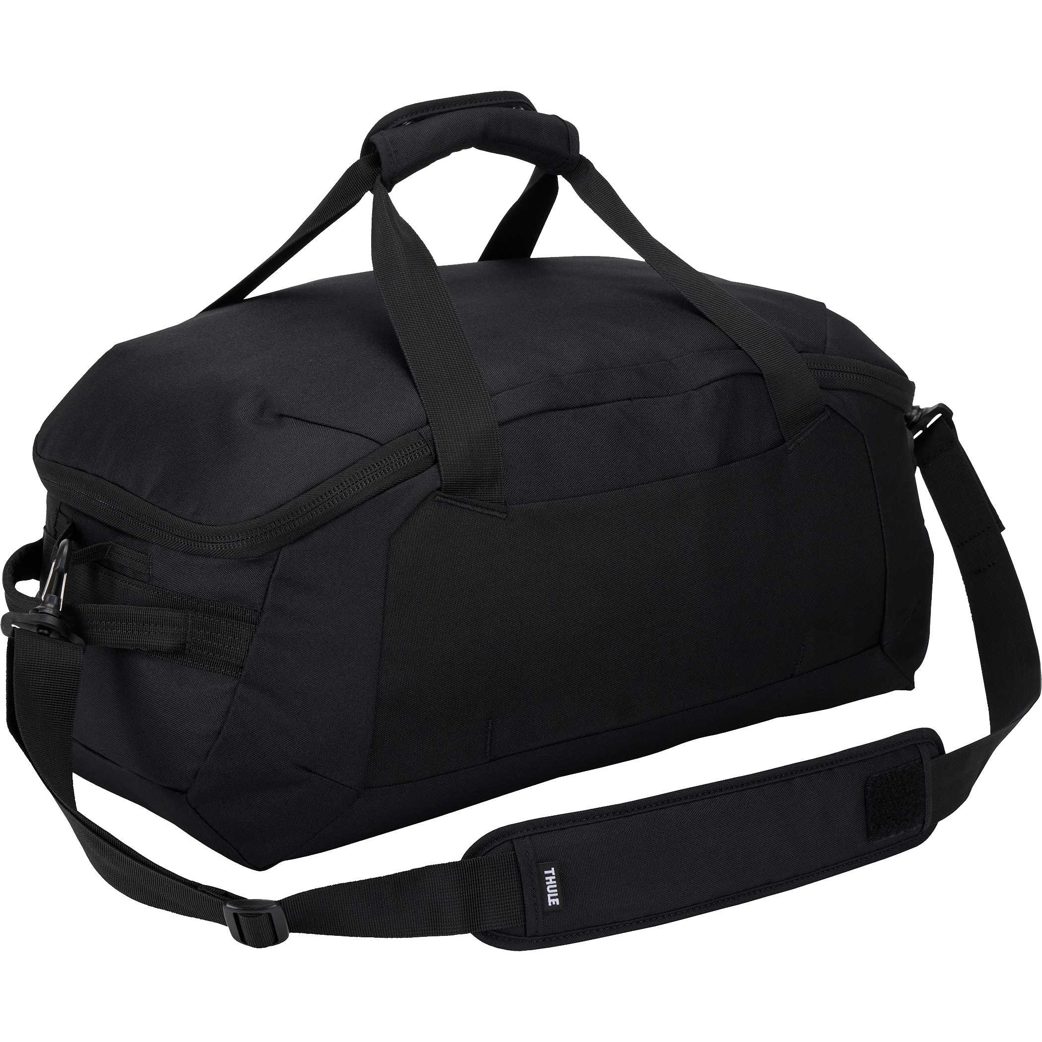 The back of Thule Lumion Duffle in black recycled polyester material placed in a modern travel setting, shown as a spacious duffel bag with structured shape and front zippered pocket designed for organized packing and travel use.