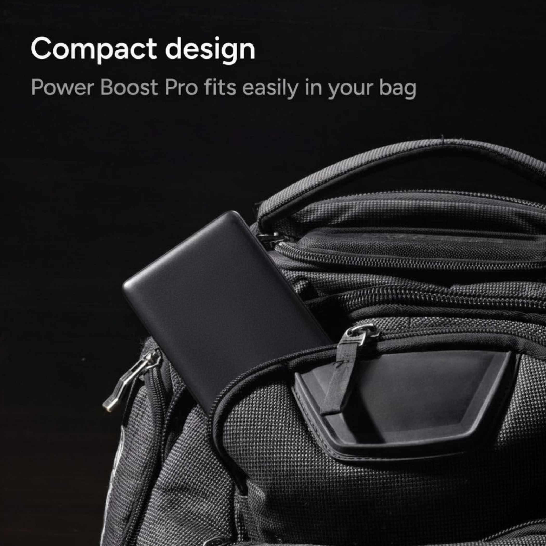 mophie Power Boost Pro XL portable power bank in black portable charger placed inside a backpack compartment with a phone and charging cable partially visible, highlighting travel-ready power storage in an everyday carry bag setting.