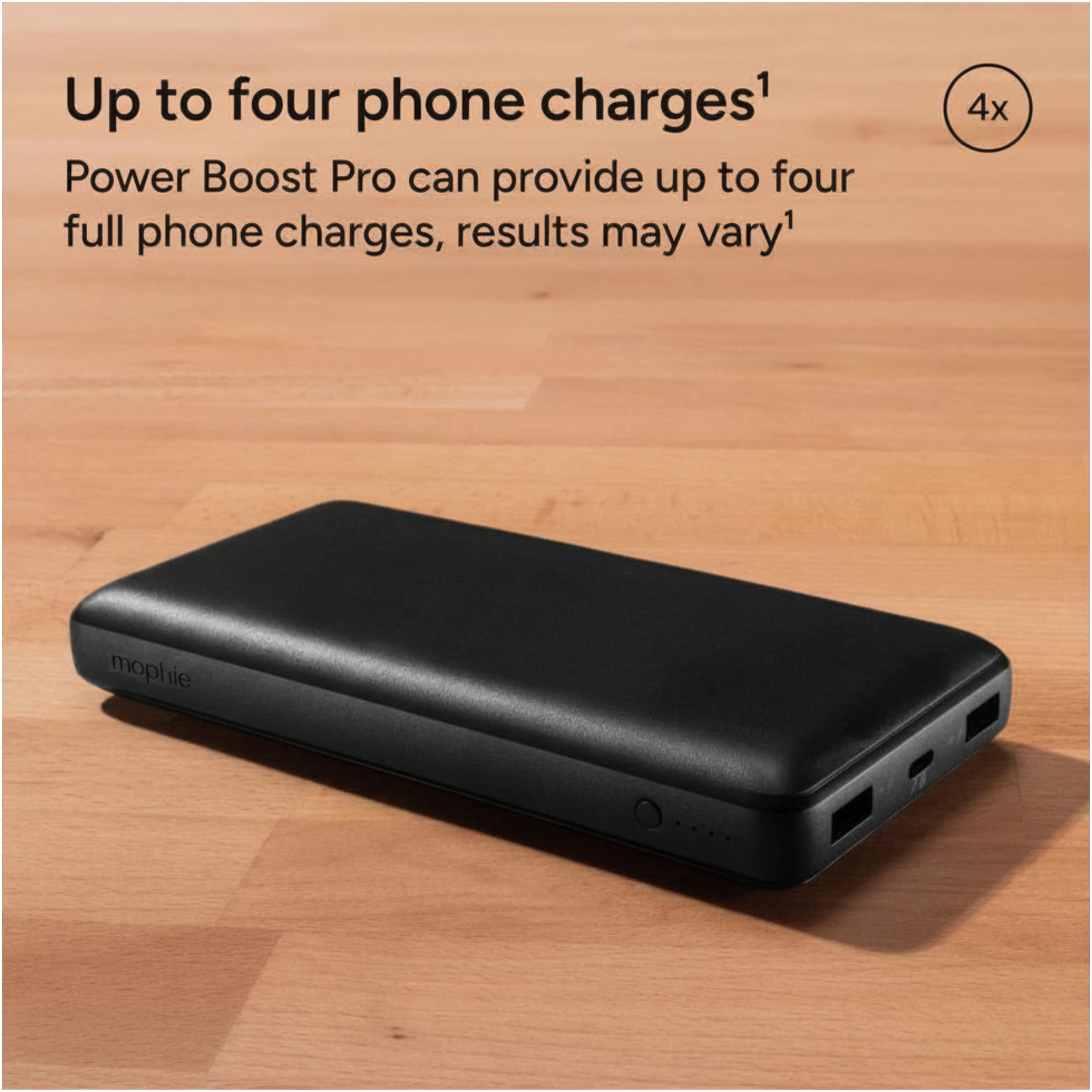 mophie Power Boost Pro XL portable power bank in black resting on a desk, showing different charging port.