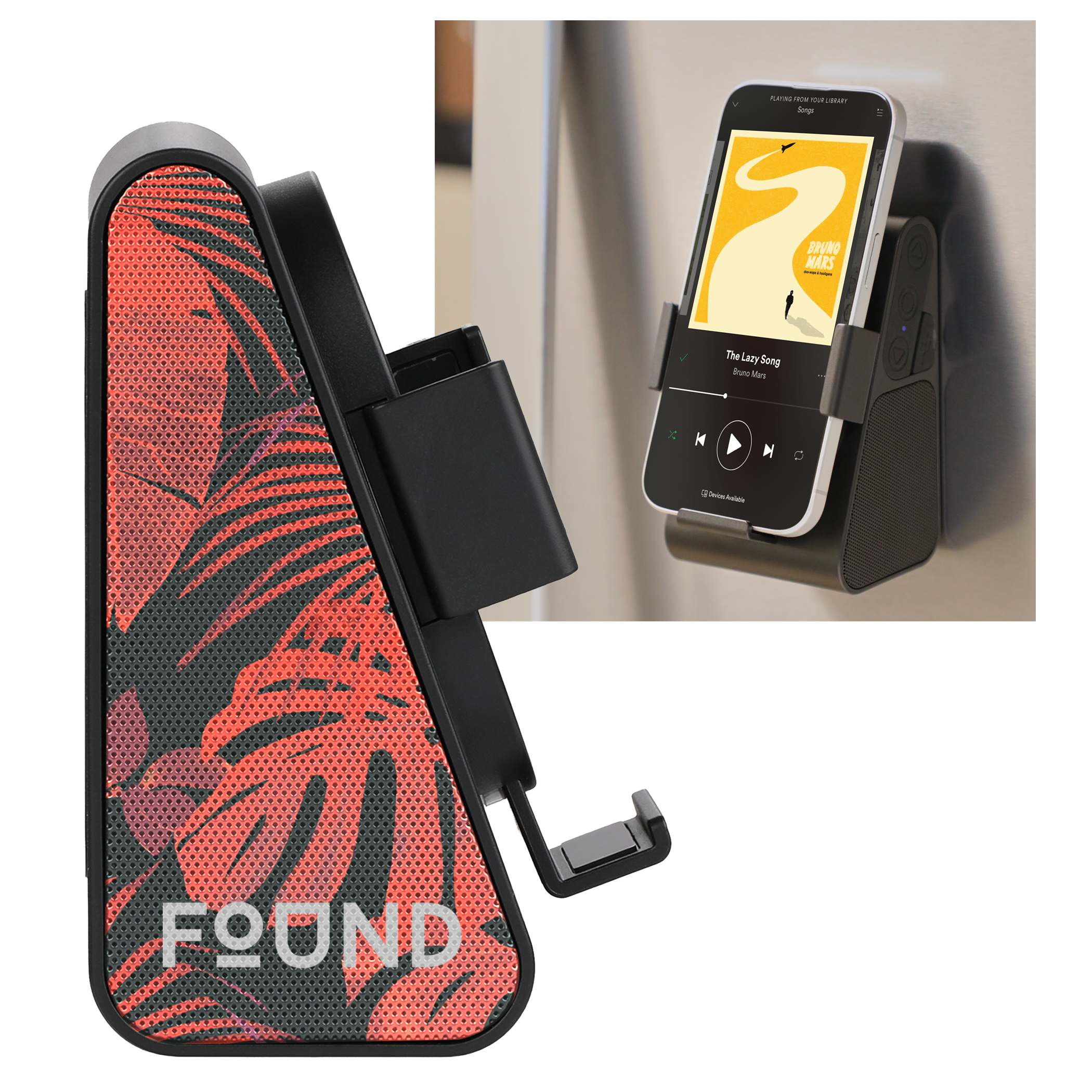 Phone Grip Outdoor Magnetic Bluetooth Speaker in black ABS plastic attached to a metal surface in an outdoor recreation setting, with the built-in phone stand holding a smartphone for hands-free viewing and audio playback.