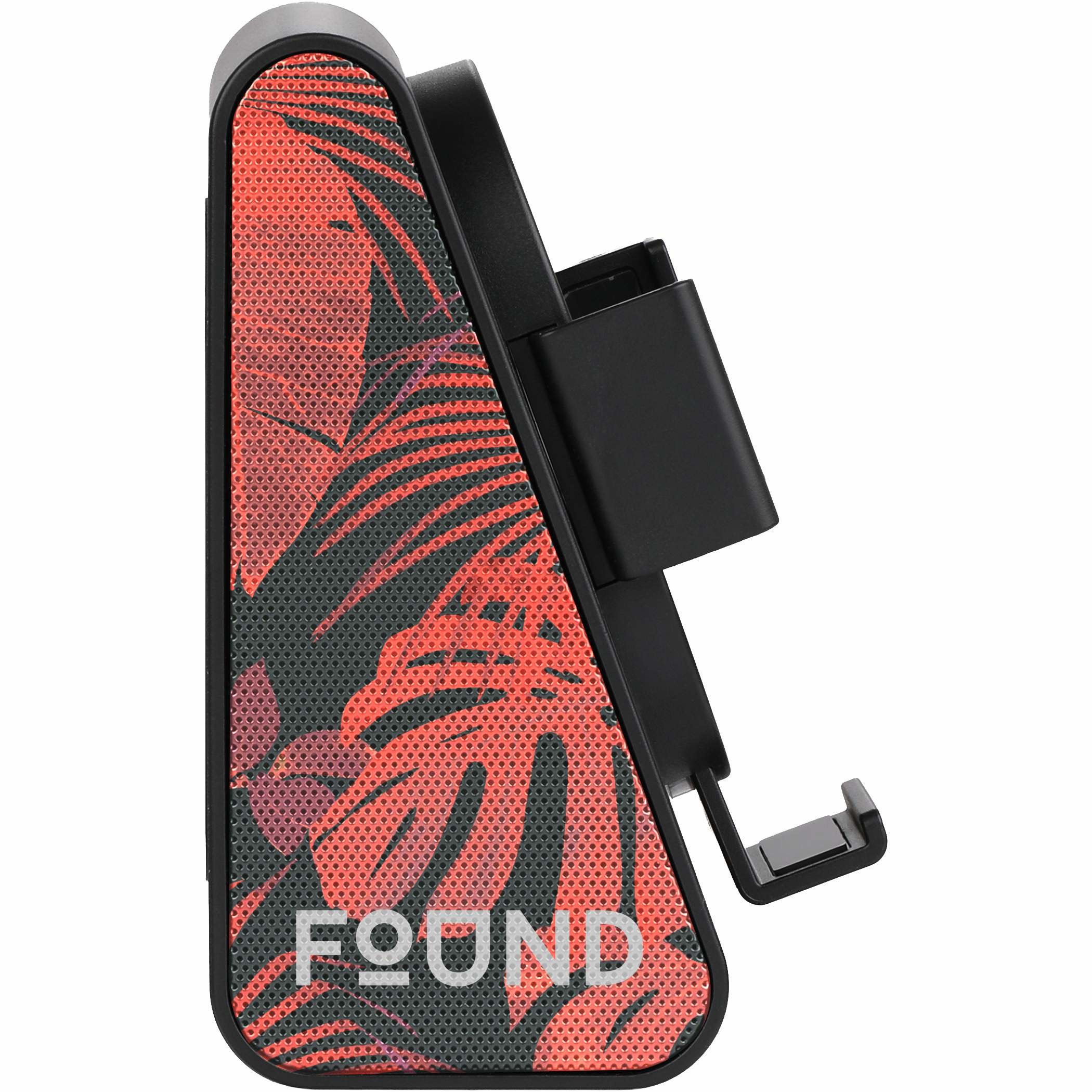 Black Phone Grip Outdoor Magnetic Bluetooth Speaker with a compact rectangular ABS plastic body, featuring a IPX4 water resistance, built-in magnetic back for mounting on metal surfaces, an integrated phone stand, and front-facing speaker grille. Portable outdoor Bluetooth speaker designed for hands-free use with smartphones.