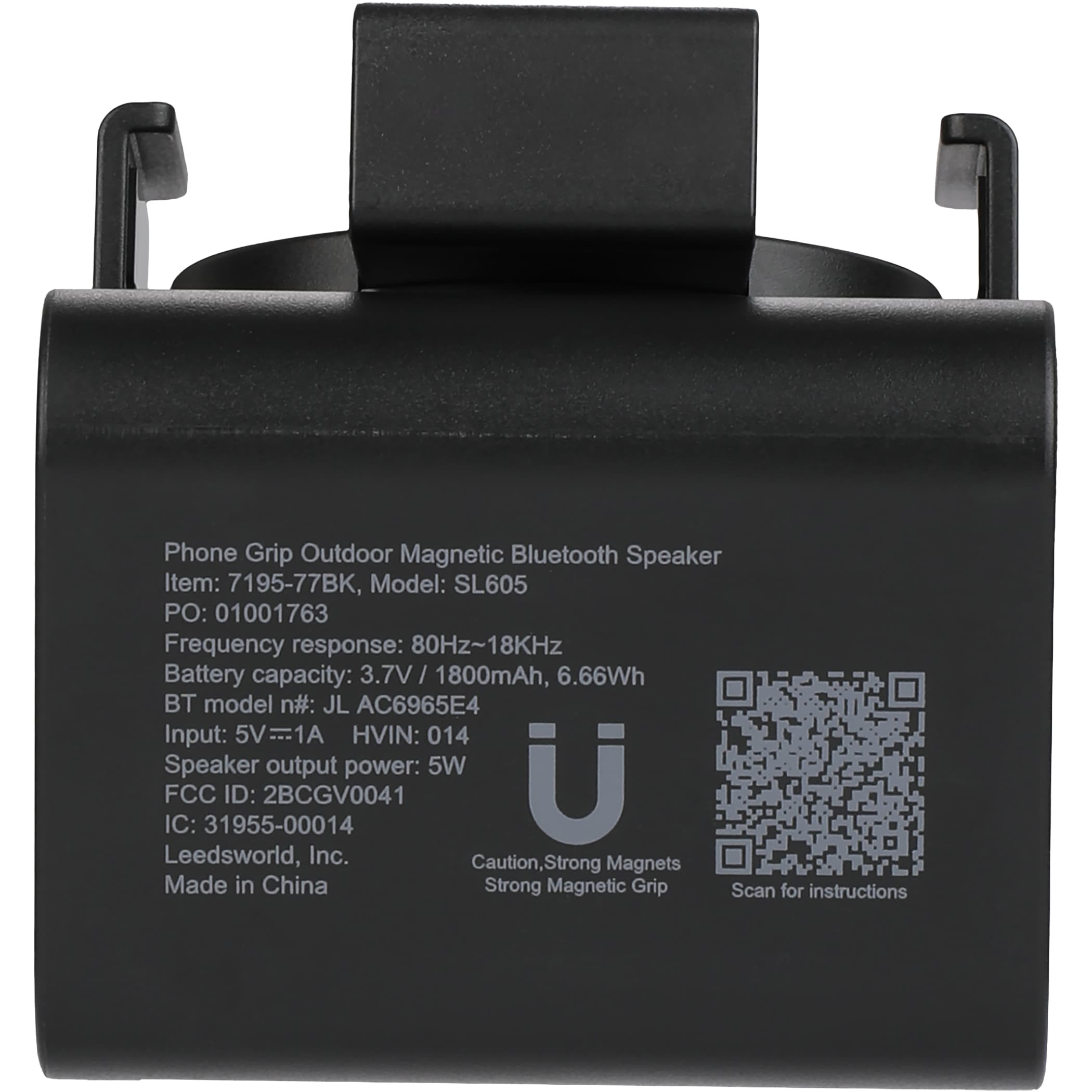 Phone Grip Outdoor Magnetic Bluetooth Speaker in black ABS plastic shown mounted to a metal surface in a fitness or locker-style environment, highlighting the magnetic attachment and integrated phone stand for stable, hands-free use.