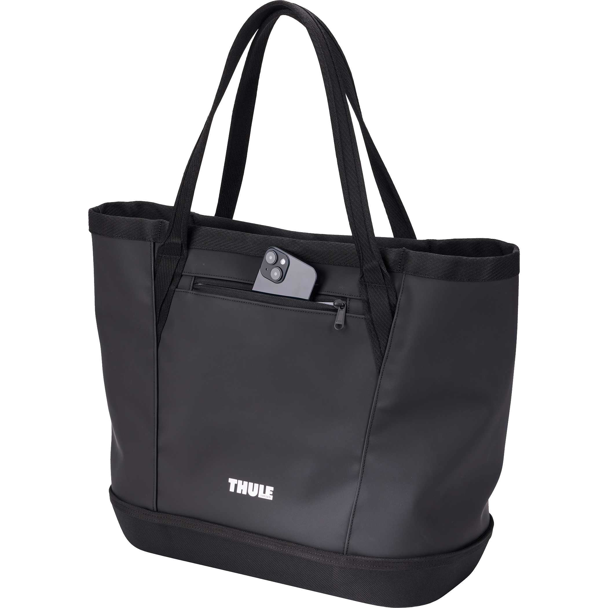 Thule 30L Chasm Gear Tote in black durable weather-resistant fabric with sturdy tote handles and a visible front zippered pocket,highlighting its use as a rugged, organized carry bag for active everyday and adventure storage.