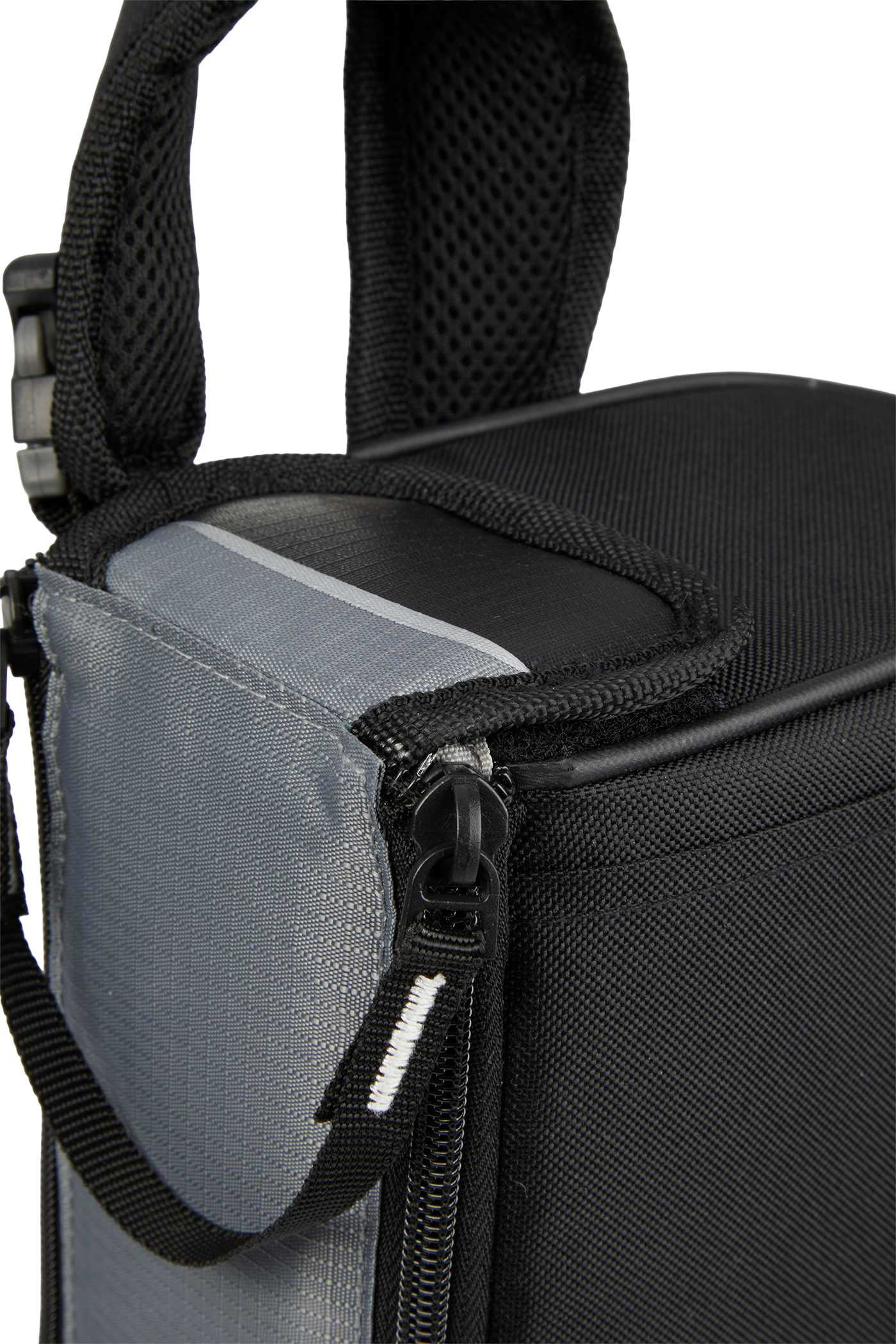 Arctic Zone Rolltop Cinch Cooler in black insulated fabric with roll-top closure and adjustable shoulder straps, shown in a lifestyle outdoor setting on a picnic table alongside food and drinks, highlighting its use as a portable cooler for travel, picnics, and outdoor gatherings.