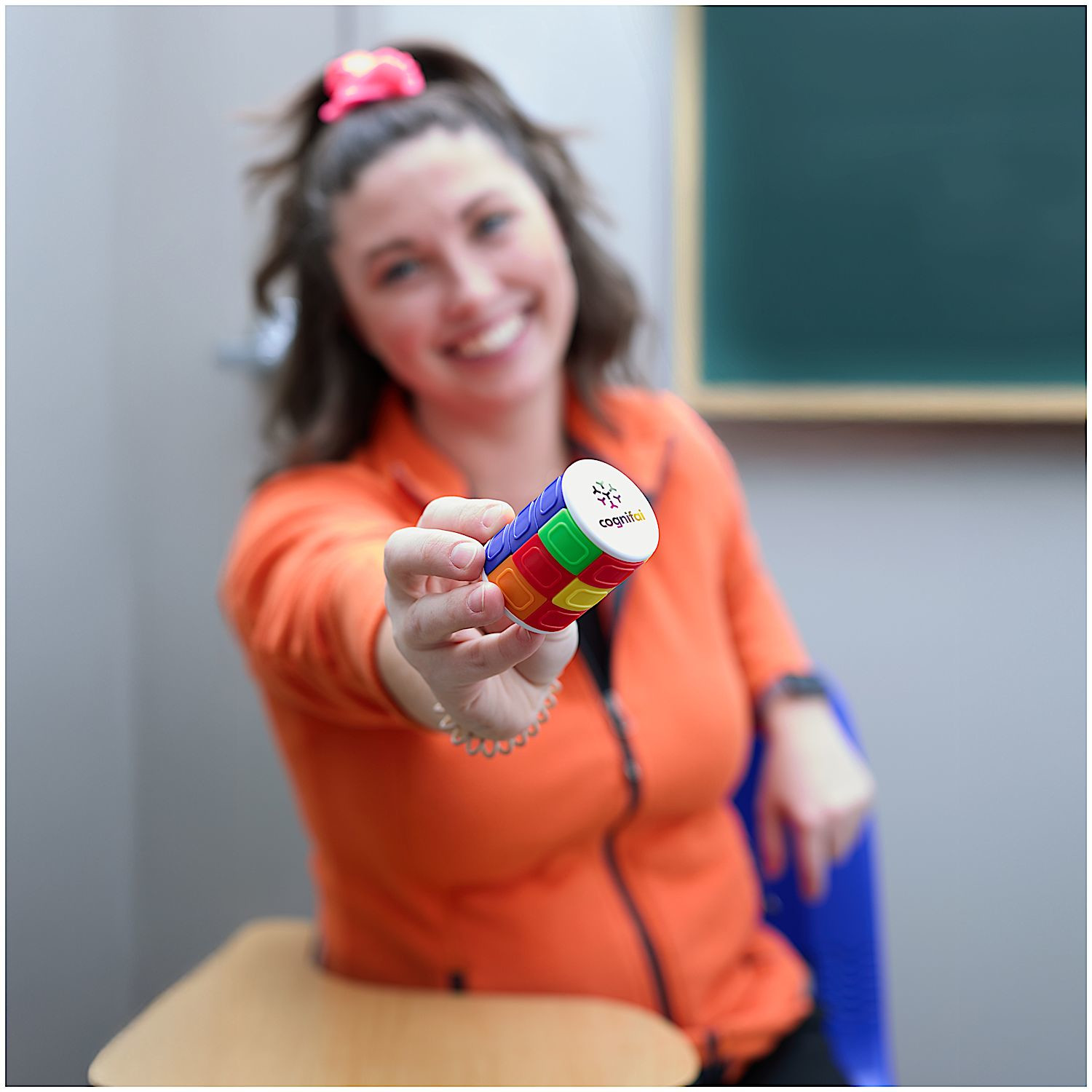 Multi-colored twist-and-slide puzzle toy with circular design for interactive brain teaser play and stress relief.