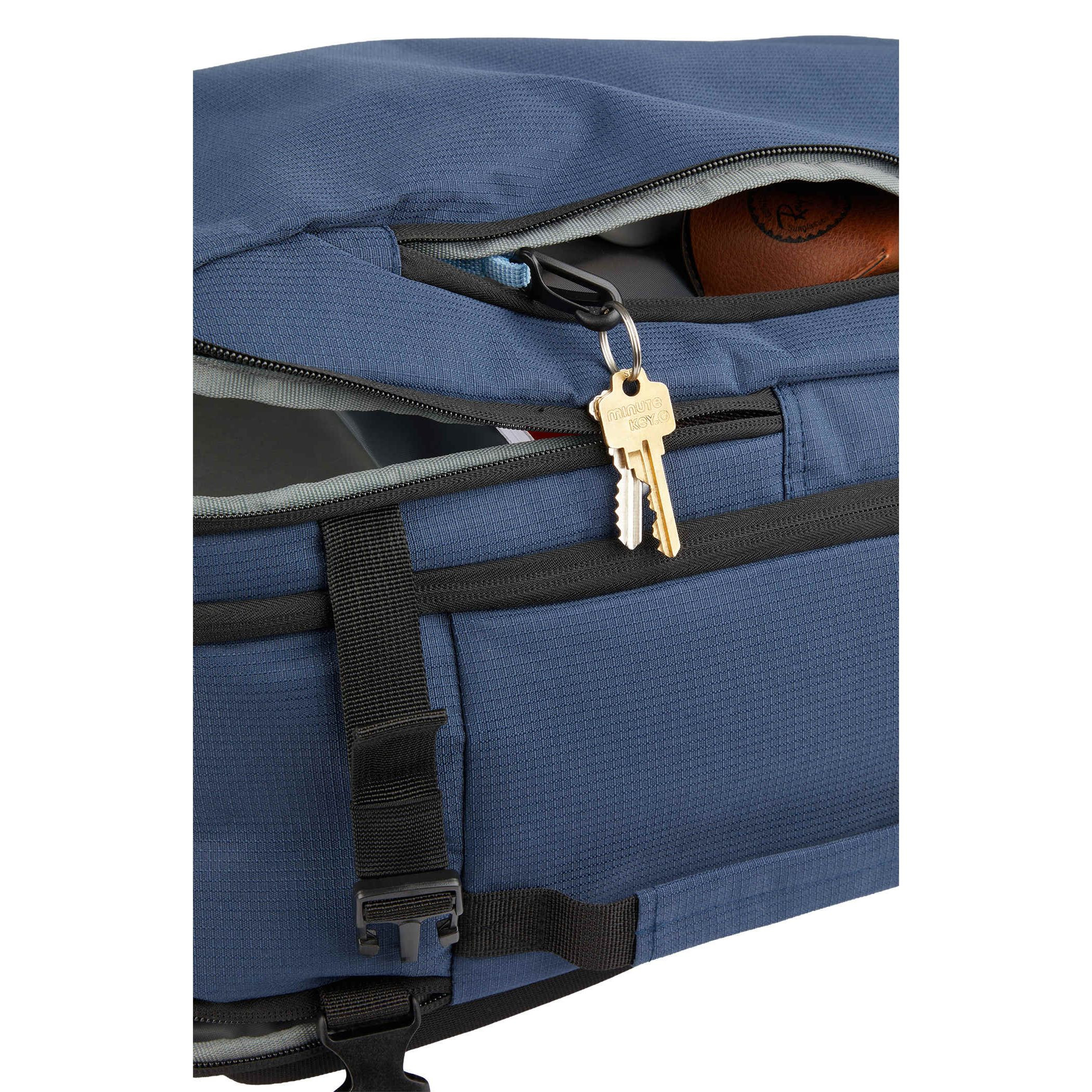 Navy Wander & Roam Travel Backpack, made from durable RPET 300D recycled fabric, shown with a structured rectangular shape, flat-opening main compartment design, padded laptop sleeve section, front zip organization pocket, and side and top grab handles, designed for travel and commuting use.