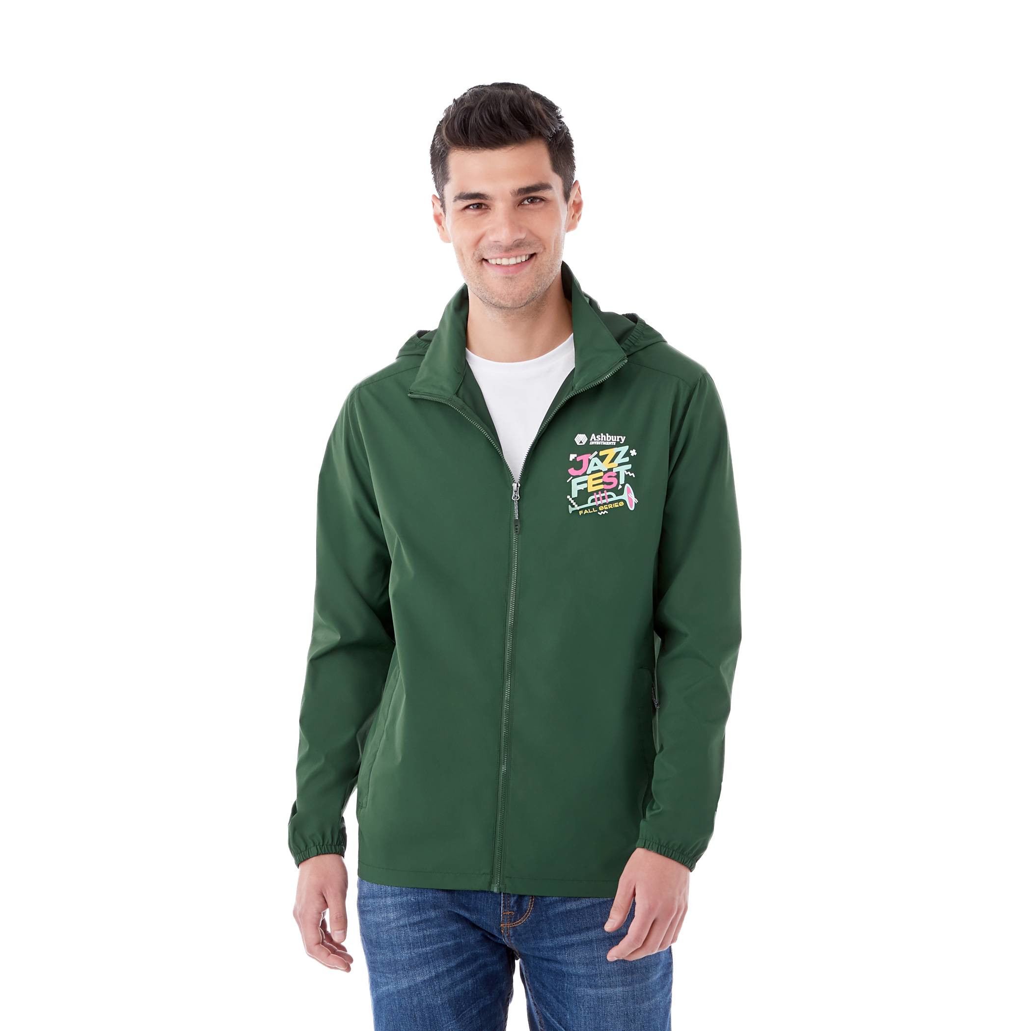 A Man wearing Forest Green Men’s TOBA Packable Jacket made from lightweight 100% polyester with a smooth woven finish, featuring a full-zip front closure, roll-away hood, and packable design that folds into the lower left pocket, shown as a lightweight water-resistant outerwear jacket for travel and outdoor weather protection.