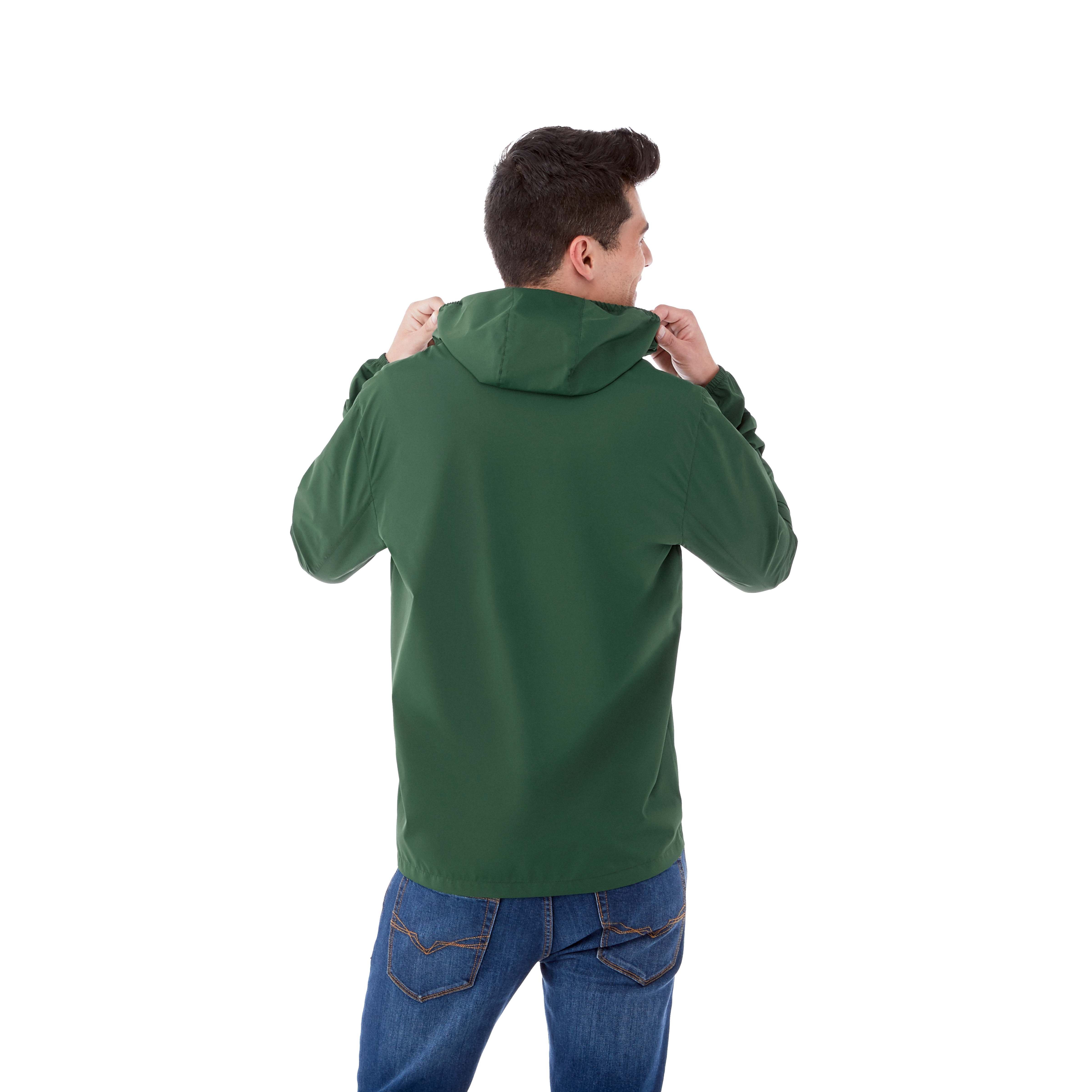 A Man wearing Forest Green Men’s TOBA Packable Jacket made from lightweight 100% polyester with a smooth woven finish, featuring a full-zip front closure, roll-away hood, and packable design that folds into the lower left pocket, shown as a lightweight water-resistant outerwear jacket for travel and outdoor weather protection.