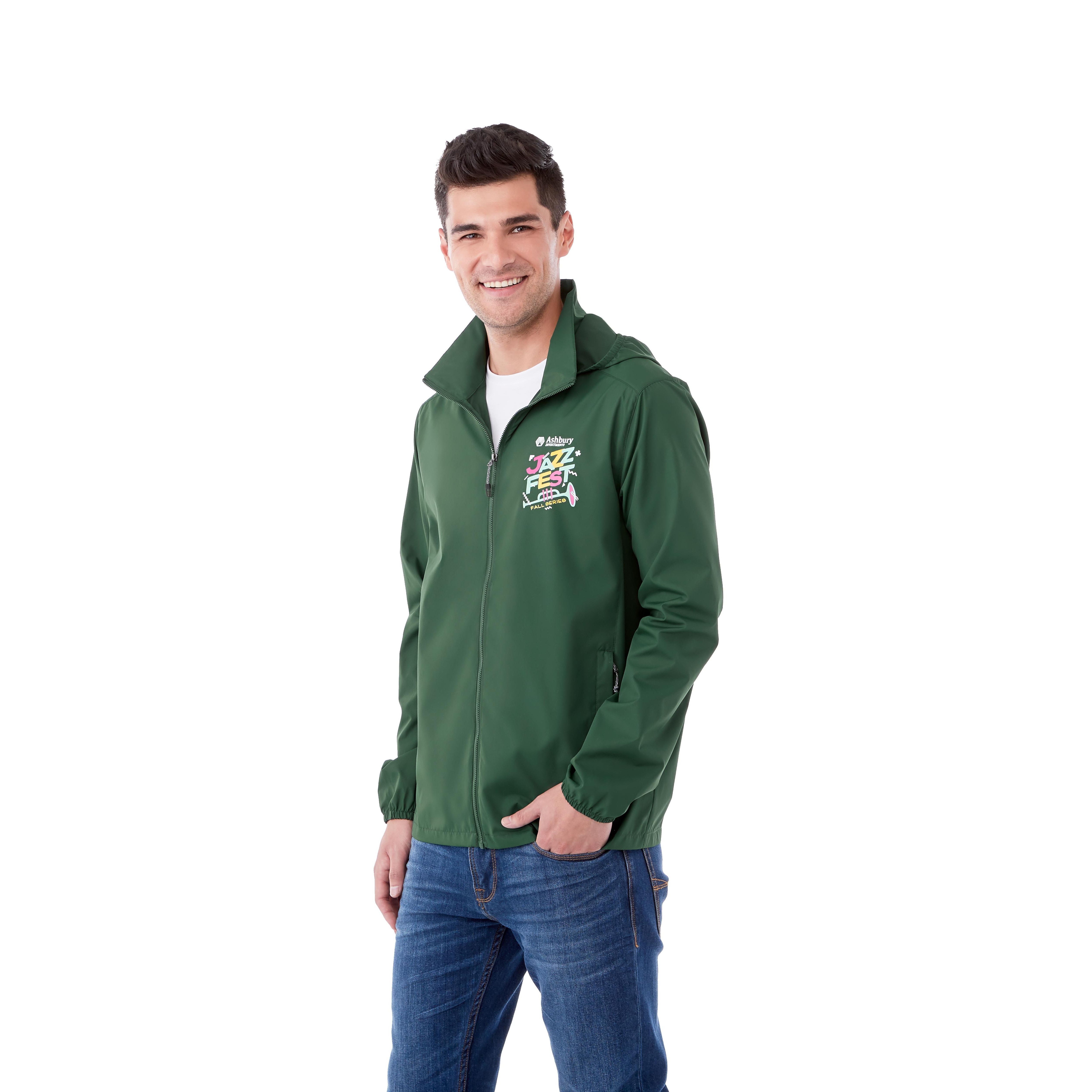A Man wearing Forest Green Men’s TOBA Packable Jacket made from lightweight 100% polyester with a smooth woven finish, featuring a full-zip front closure, roll-away hood, and packable design that folds into the lower left pocket, shown as a lightweight water-resistant outerwear jacket for travel and outdoor weather protection.