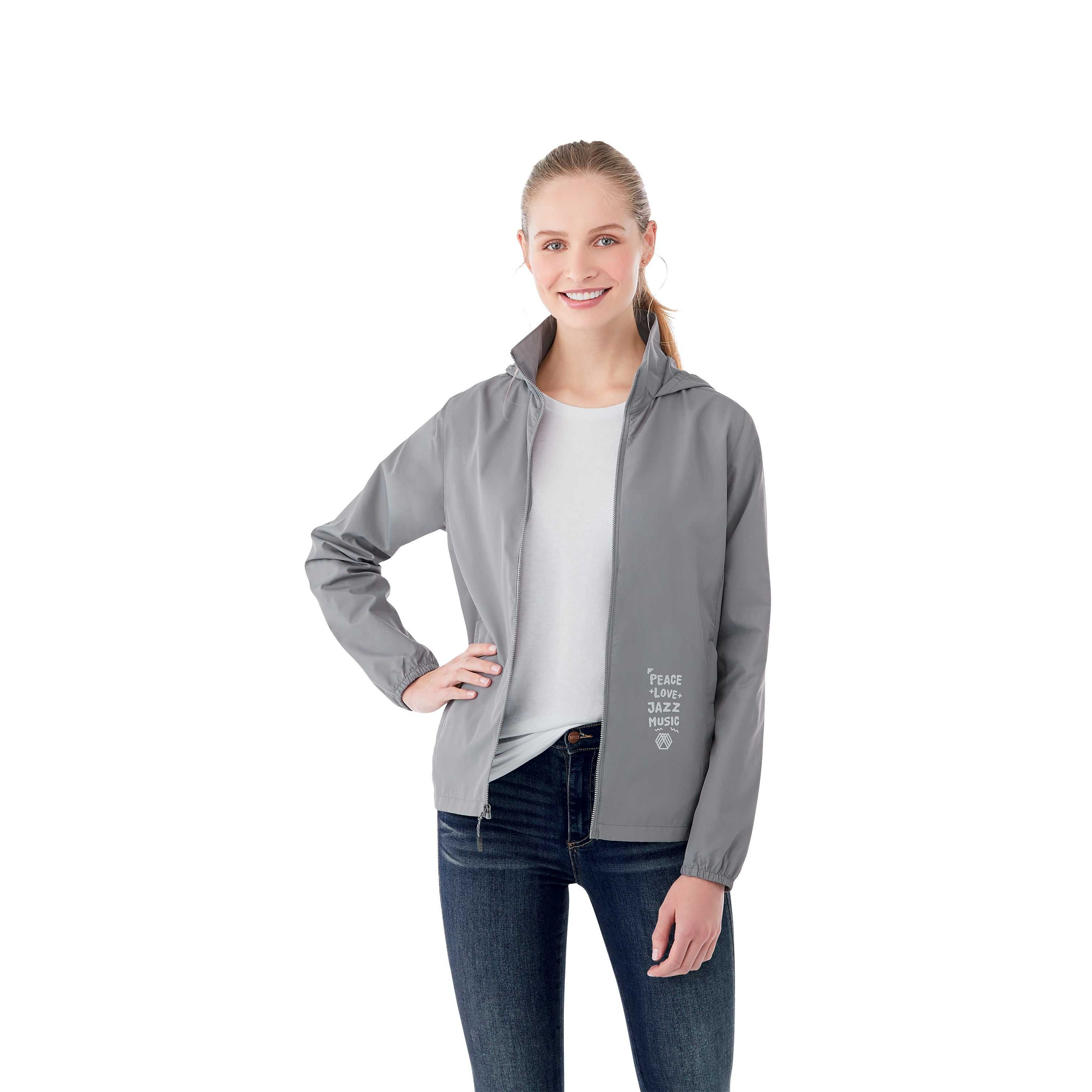 A Woman wearing Quarry Women’s Toba Packable Jacket in a lightweight outerwear design made from water-resistant polyester fabric, featuring a full front zipper, adjustable roll-away hood, articulated sleeves, and a slightly tapered waist for a feminine fit. The jacket has a smooth, matte finish and is designed for packable convenience, folding into its own pocket for easy travel and weather protection.