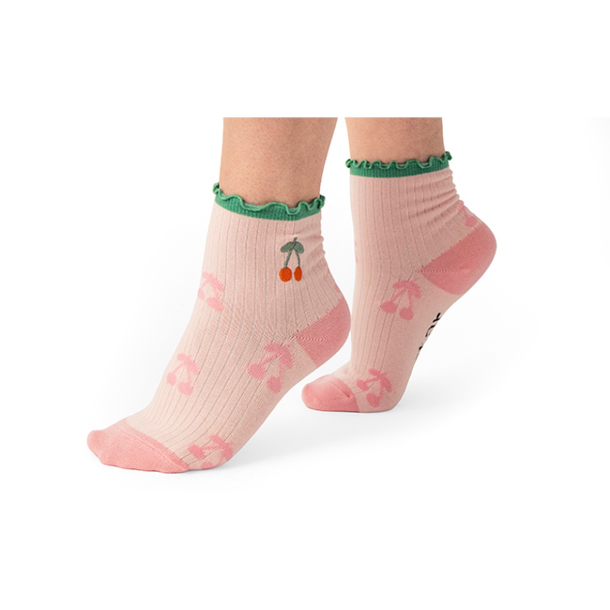 Crew-length socks with soft knit fabric, ribbed cuffs, and decorative ruffle trim at the top for a stylish and comfortable everyday look.