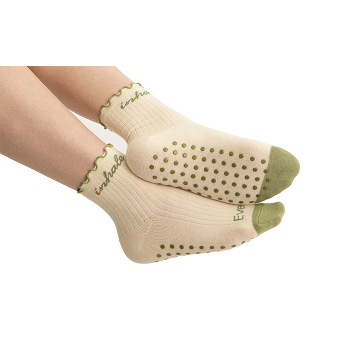 Crew-length socks with soft knit fabric, ribbed cuffs, and decorative ruffle trim at the top for a stylish and comfortable everyday look.