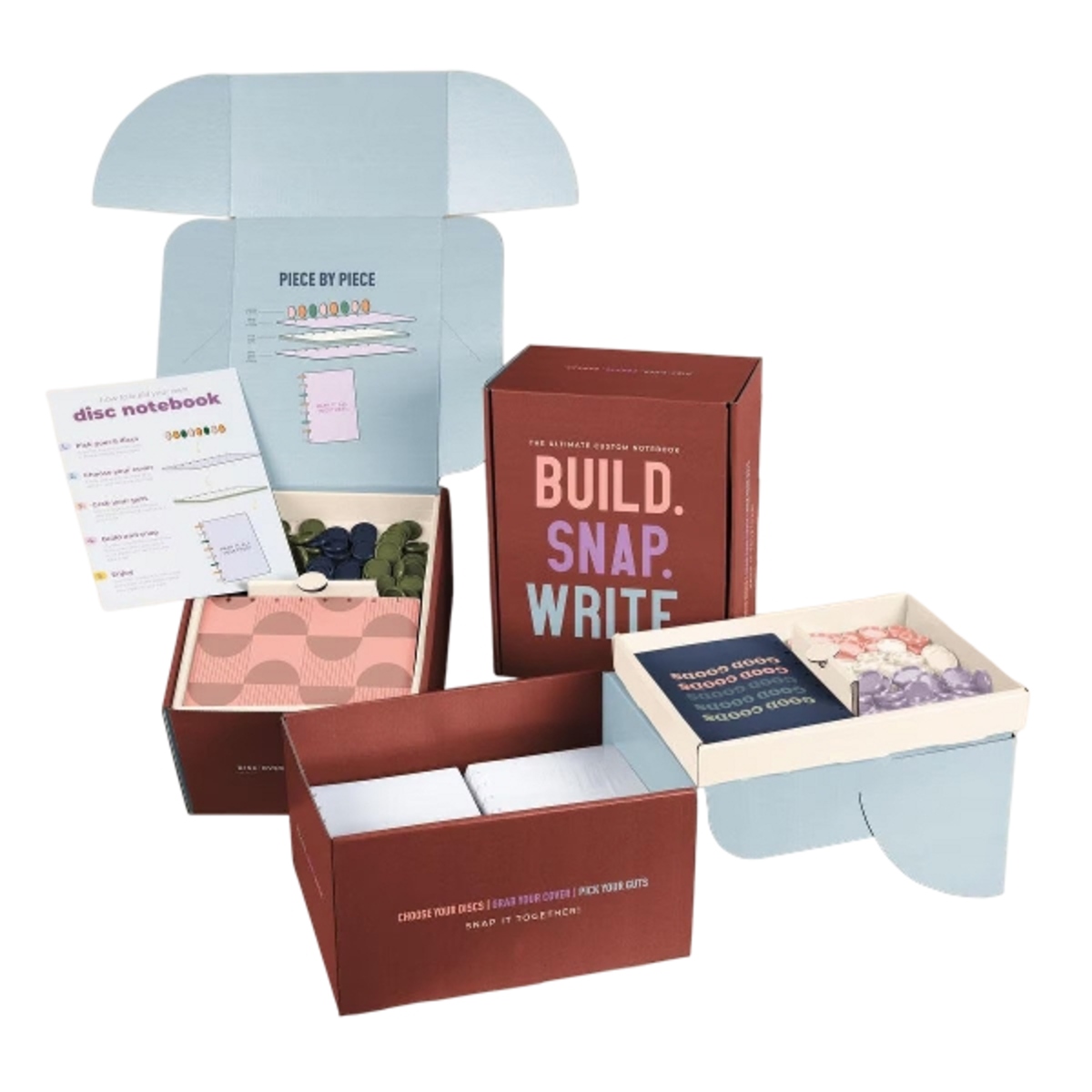 Interactive notebook kit with customizable covers, pages, and binding discs, packaged in a branded box for hands-on assembly