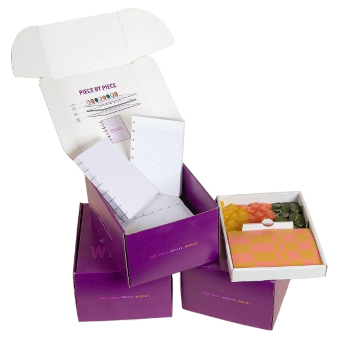 Interactive notebook kit with customizable covers, pages, and binding discs, packaged in a branded box for hands-on assembly