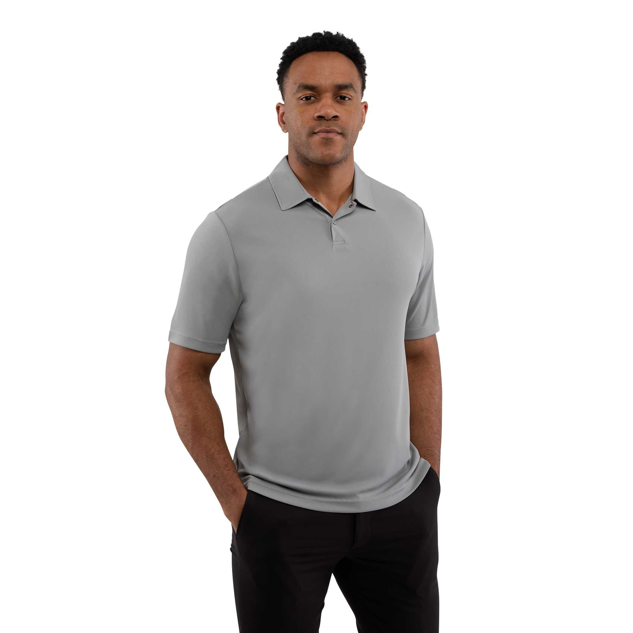 A man wearing a Quarry Men’s Dara Recycled Tech Polo made from structured recycled polyester fabric during an outdoor event. The short-sleeve polo features a modern two-snap button placket, clean snag-resistant texture, and an athletic fit, showcasing its use as professional corporate apparel.