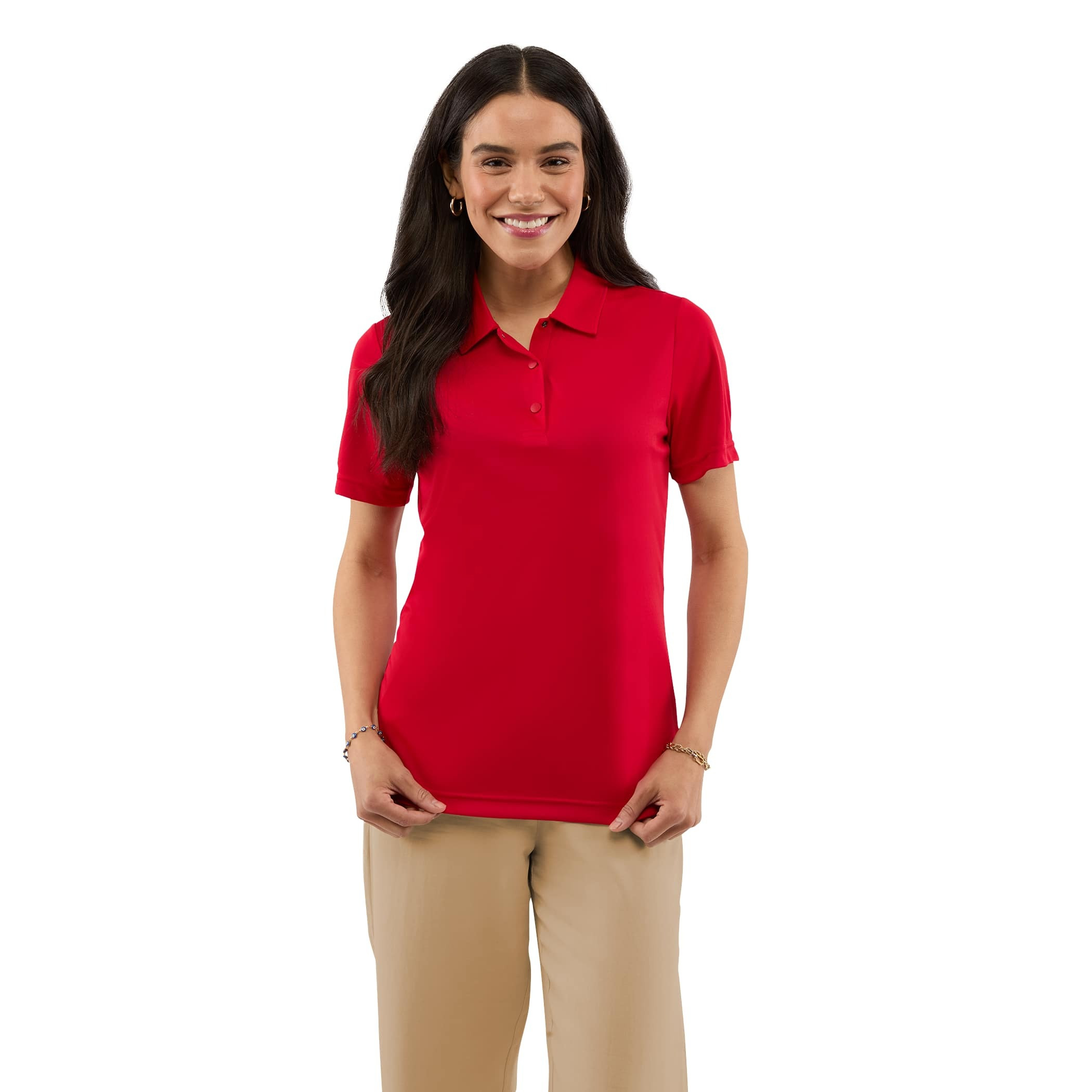 A woman wearing a Team Red Women’s Dara Recycled Tech Polo made from structured recycled polyester fabric during an outdoor event. The short-sleeve polo features a modern two-snap button placket, clean snag-resistant texture, and an athletic fit, showcasing its use as professional corporate apparel.