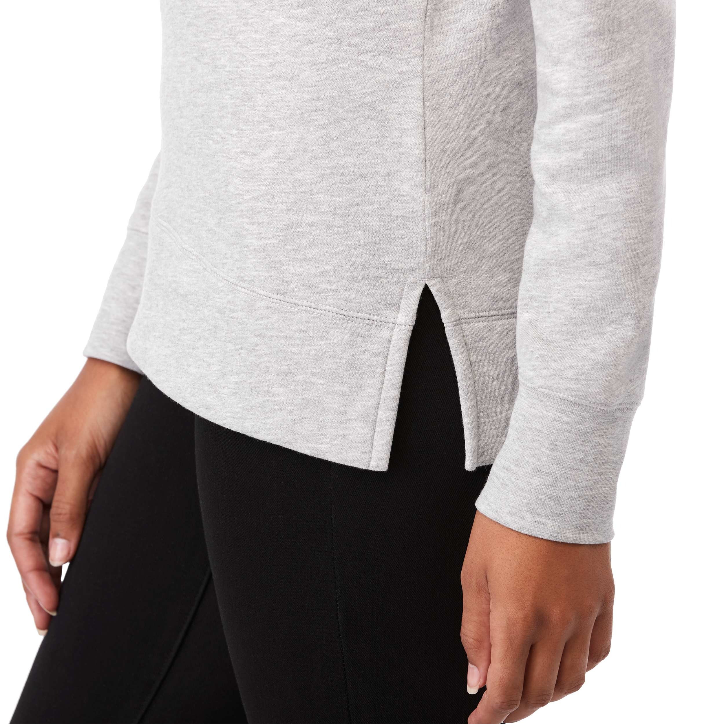A woman wearing Heather Gray Secondary Dayton Classic Fleece Half Zip Pullover featuring a soft cotton-polyester fleece fabric, stand collar with half-zip front, long sleeves, and rib-knit cuffs and hem, designed for comfortable everyday layering and casual wear.