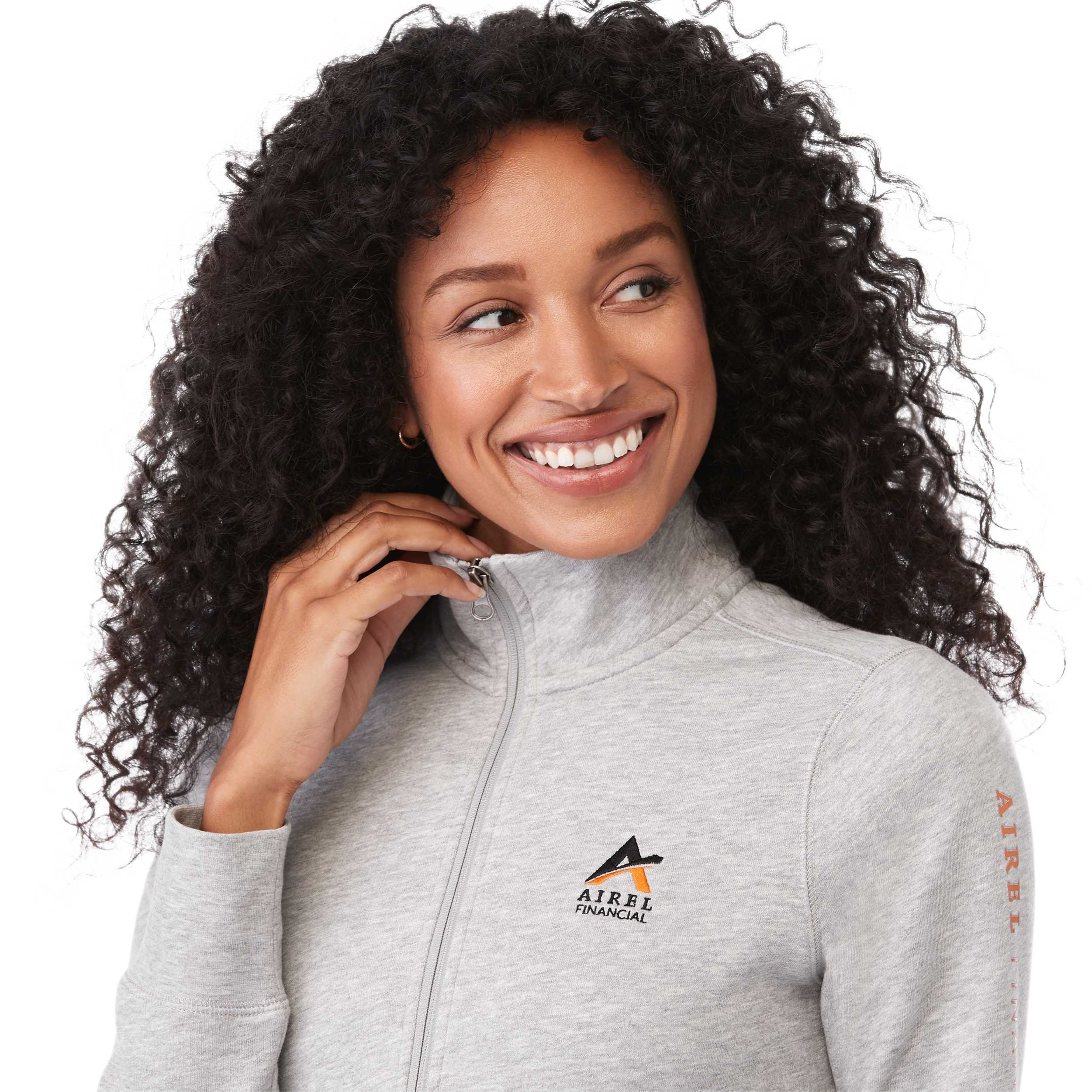 A woman wearing Heather Gray Secondary Dayton Classic Fleece Half Zip Pullover featuring a soft cotton-polyester fleece fabric, stand collar with half-zip front, long sleeves, and rib-knit cuffs and hem, designed for comfortable everyday layering and casual wear.