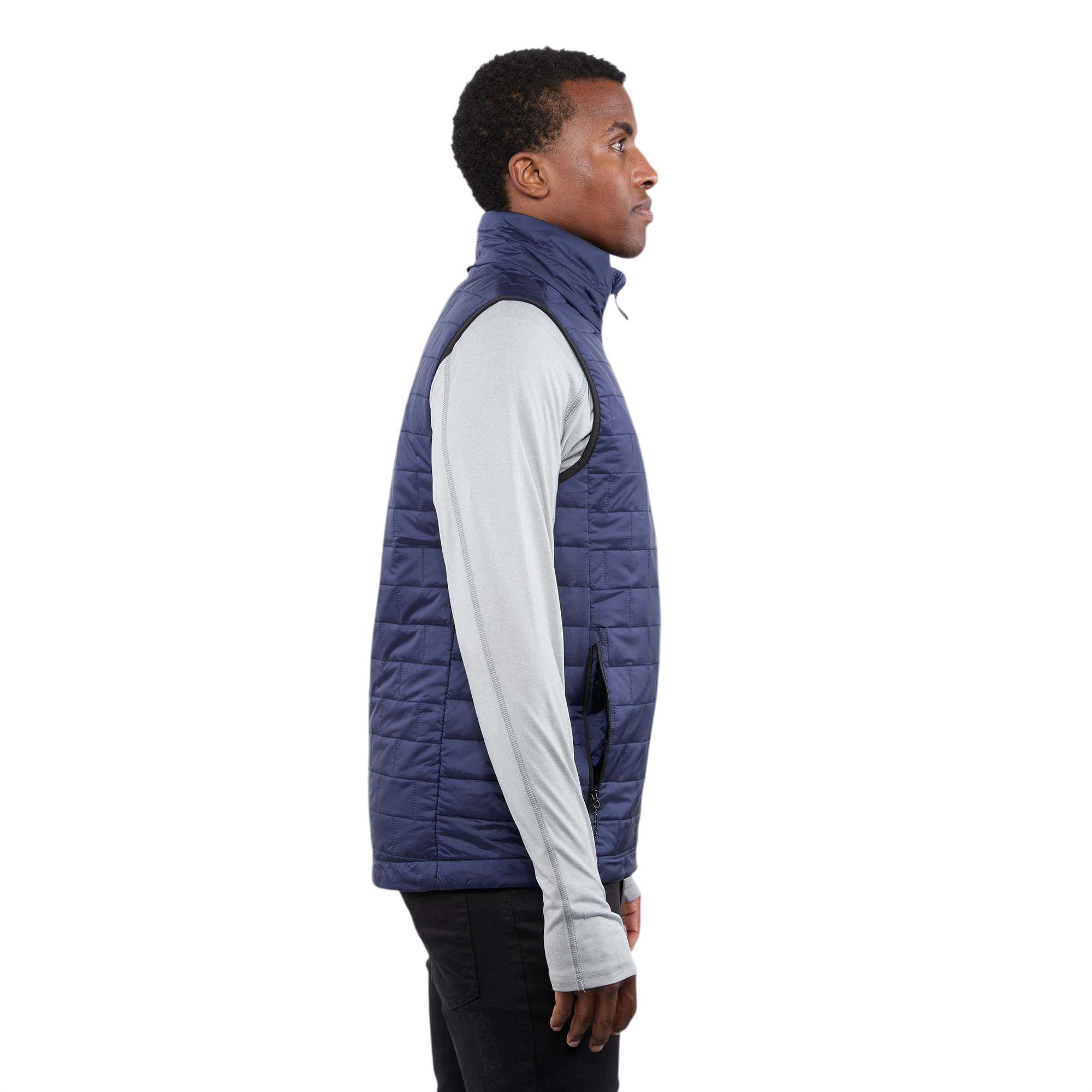 A man wearing the Men's Telluride Packable Insulated Vest in Vintage Navy, featuring a lightweight quilted nylon ripstop shell, full-zip front, stand collar, and zippered pockets, designed for comfortable layering and everyday outdoor wear.