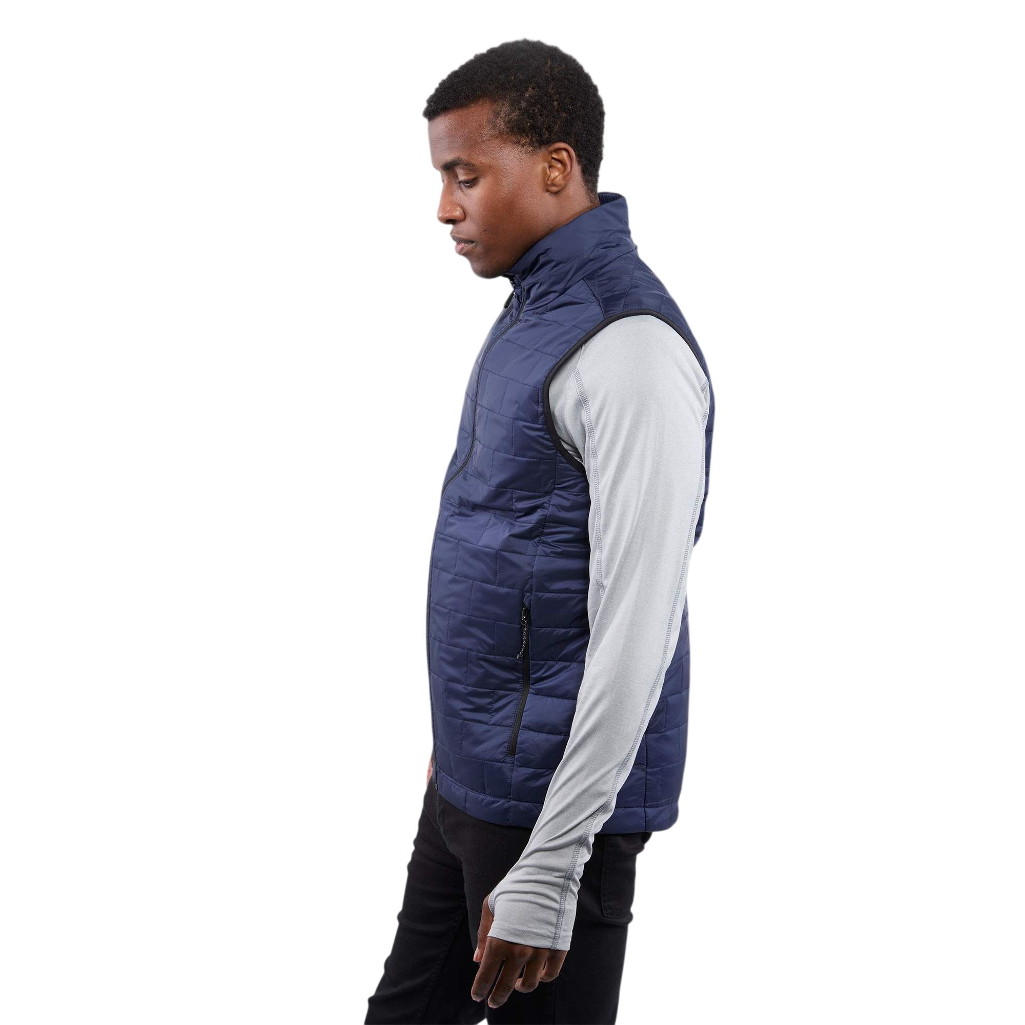 A man wearing the Men's Telluride Packable Insulated Vest in Vintage Navy, featuring a lightweight quilted nylon ripstop shell, full-zip front, stand collar, and zippered pockets, designed for comfortable layering and everyday outdoor wear.