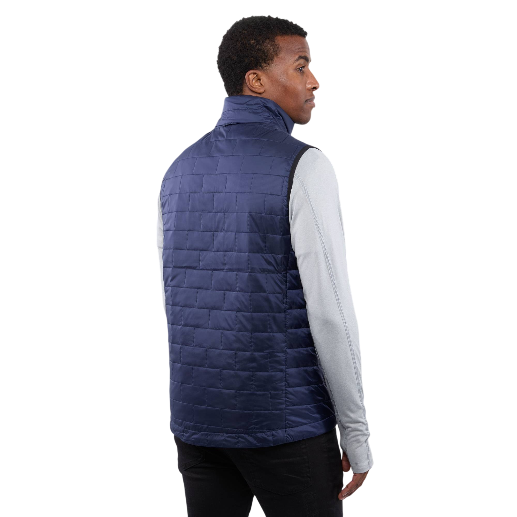 A man wearing the Men's Telluride Packable Insulated Vest in Vintage Navy, featuring a lightweight quilted nylon ripstop shell, full-zip front, stand collar, and zippered pockets, designed for comfortable layering and everyday outdoor wear.