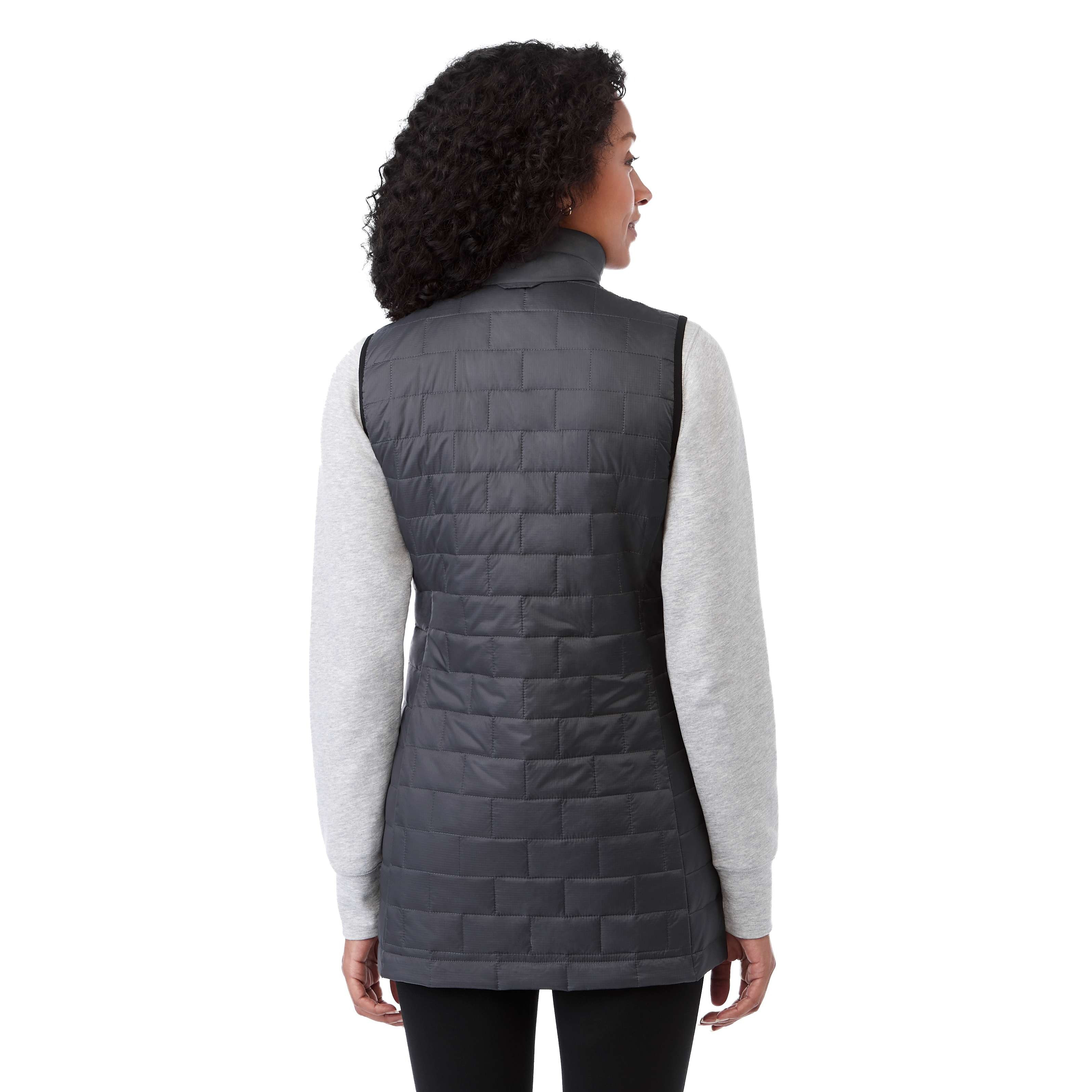 A woman wearing the Women's Telluride Packable Insulated Vest in Gray Storm, featuring a lightweight quilted nylon ripstop shell, full-zip front, stand collar, and zippered pockets, designed for comfortable layering and everyday outdoor wear.