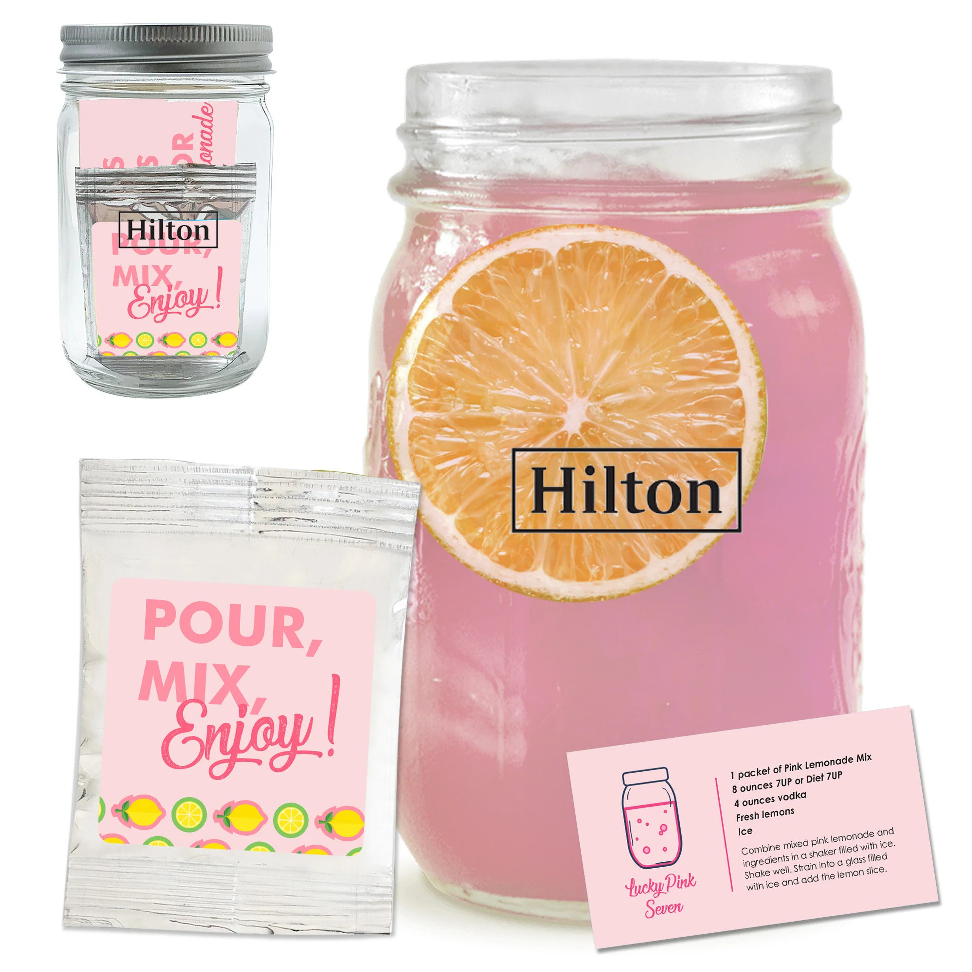 Clear glass mason jar filled with pink lemonade mix, featuring a custom logo imprint and decorative hang tag with coordinating recipe card.