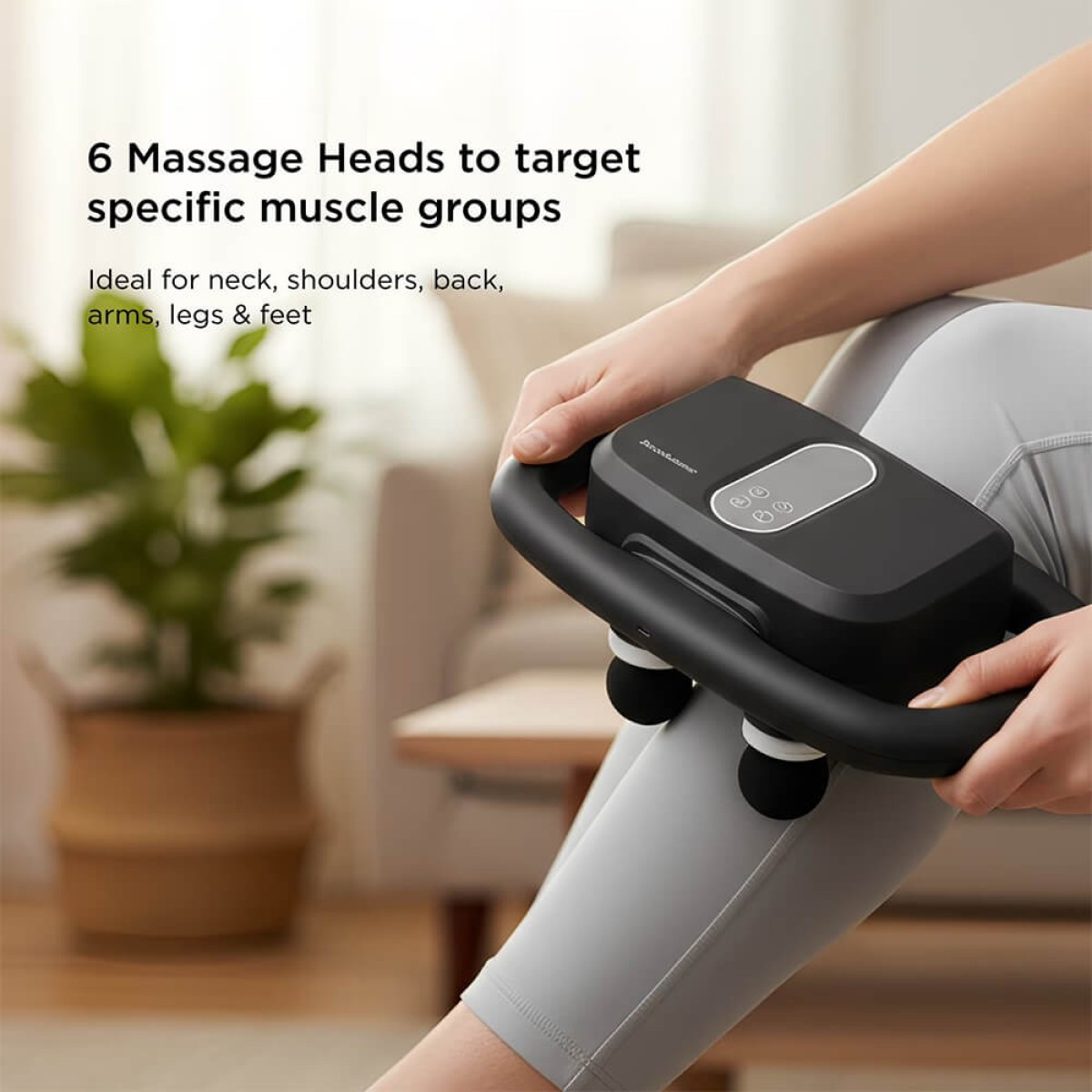 Brookstone Six Head Ultra Recovery Percussion Massager in black cordless handheld design, featuring multiple massage nodes on a pistol-style ergonomic grip with LCD display, used for deep tissue muscle recovery and relaxation on neck, back, shoulders, arms, and legs.