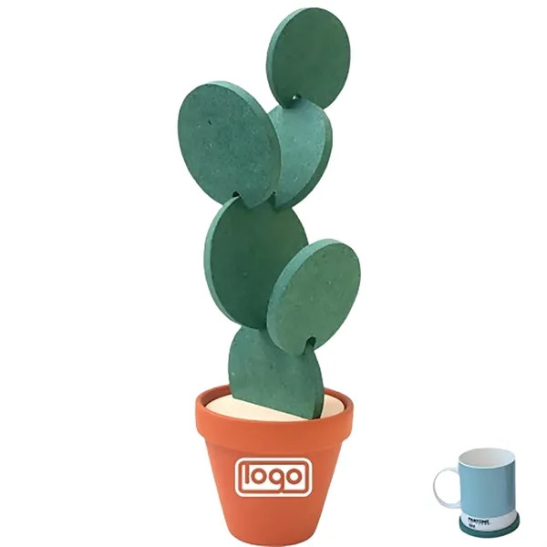 Green cactus-shaped EVA coaster with non-slip surface and heat-insulating construction designed to protect tables from scratches, moisture, and heat.