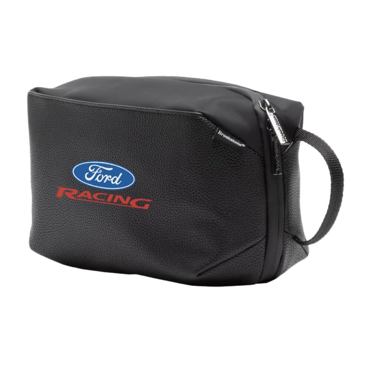 Brookstone Compact Toiletry Kit vegan leather travel bag in black with zippered main compartment, exterior zip pocket, and side grab handle, designed for organizing toiletries and personal care essentials during travel.