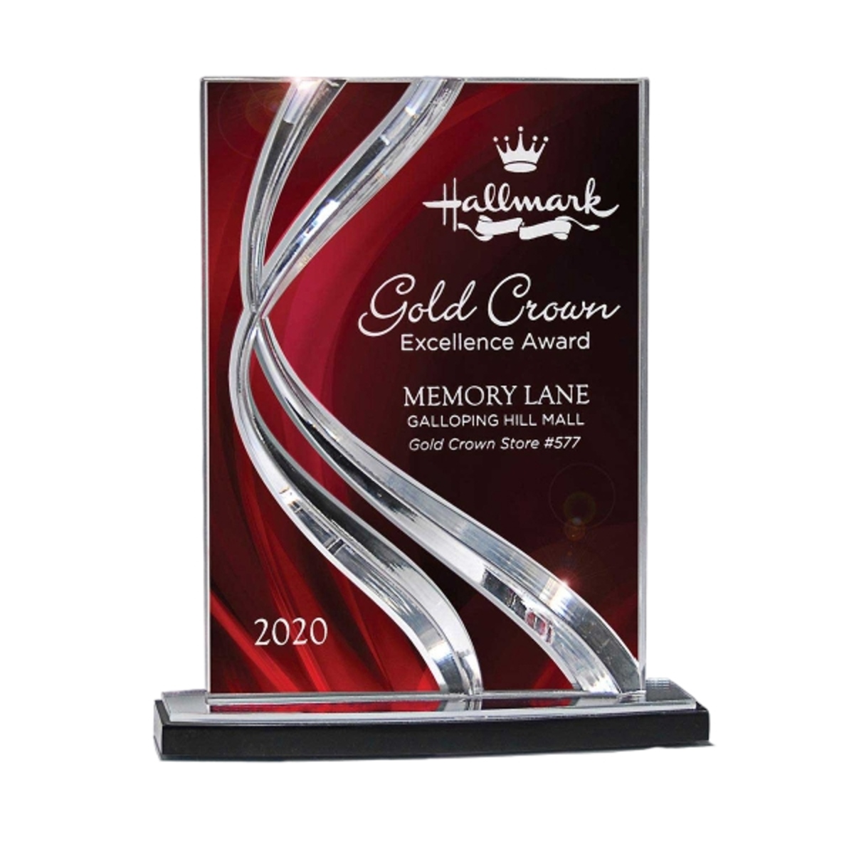 Small ribbon award with a sleek curved glass design and engraved personalization.