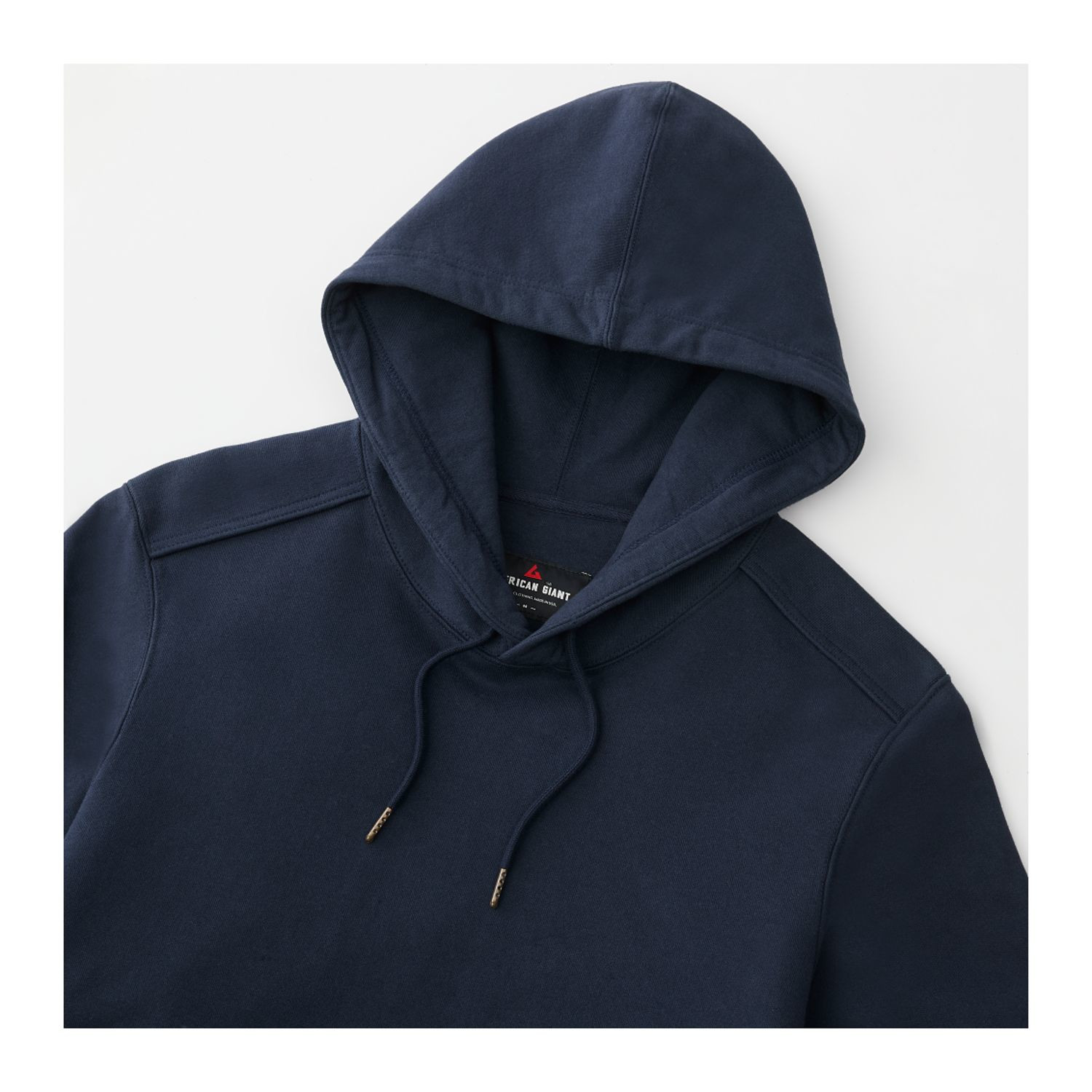 Polo blue heavyweight men’s fleece pullover hoodie with double-lined hood, ribbed side panels, and reinforced elbow patches designed for warmth and durability in cold-weather casual wear.