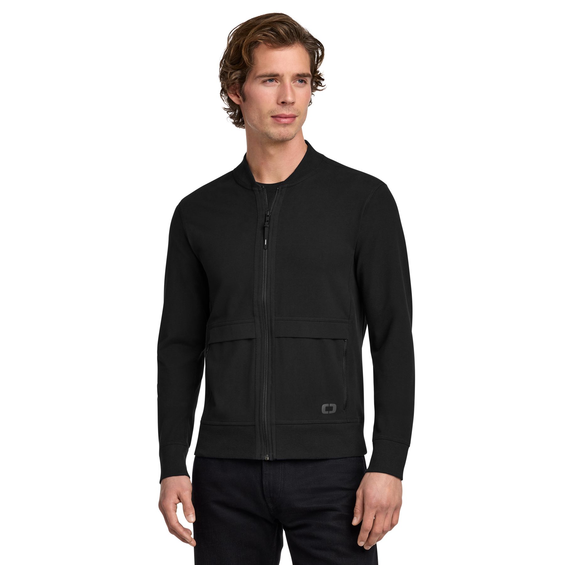 Blacktop OGIO® Outstretch Full-Zip jacket, featuring a lightweight stretch fabric, full-zip front, stand collar, and zippered pockets for active wear, travel, and everyday layering.