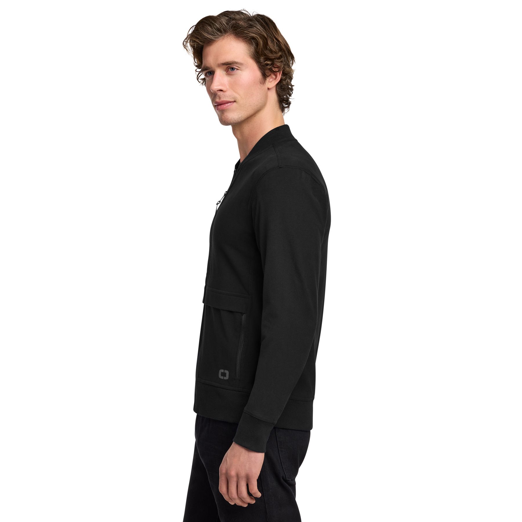 Blacktop OGIO® Outstretch Full-Zip jacket, featuring a lightweight stretch fabric, full-zip front, stand collar, and zippered pockets for active wear, travel, and everyday layering.