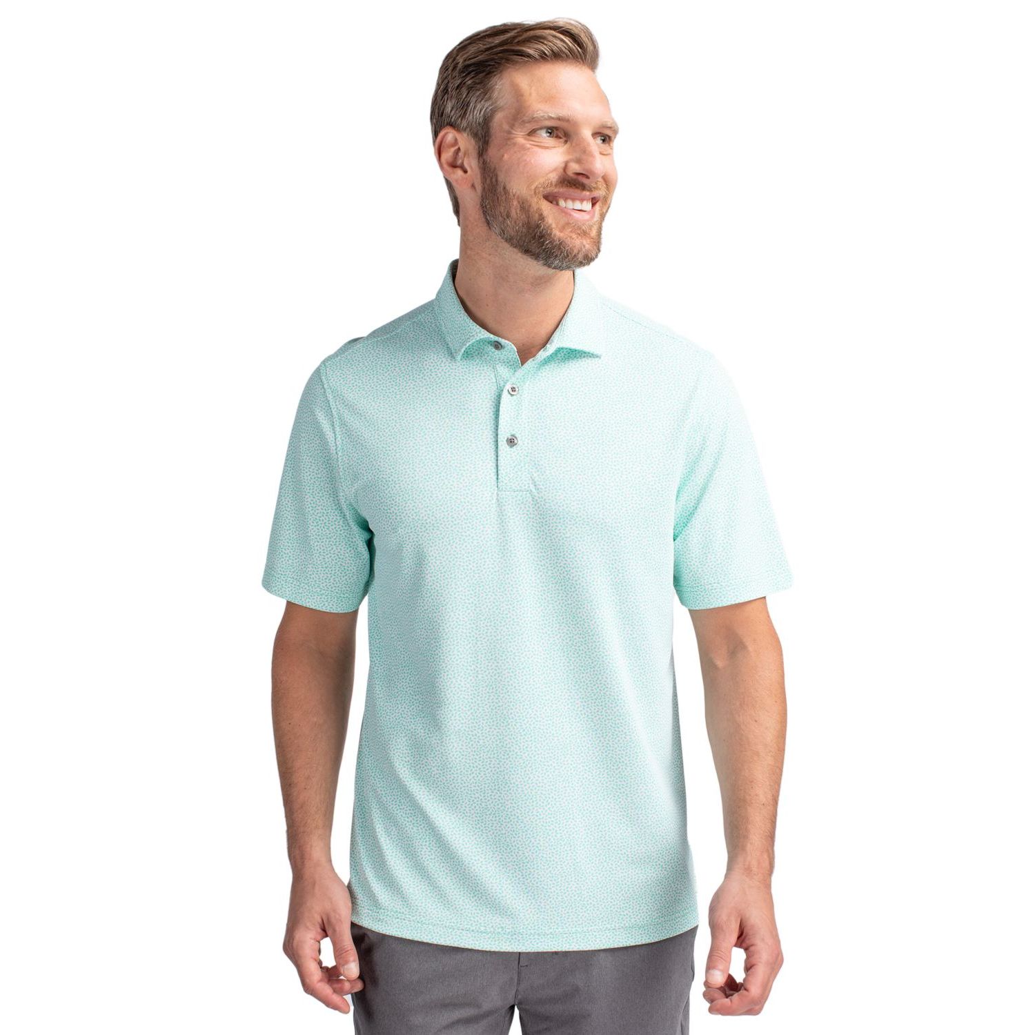 Fresh Mint Cutter & Buck Virtue Recycled Botanical Print Featherlight Pique Men’s Polo, featuring lightweight recycled stretch pique fabric with a subtle all-over botanical print, self-fabric collar, three-button placket, short sleeves, and a modern athletic fit designed for golf, travel, work, and everyday wear. The performance fabric offers moisture-wicking comfort, four-way stretch, and UPF 25+ sun protection.