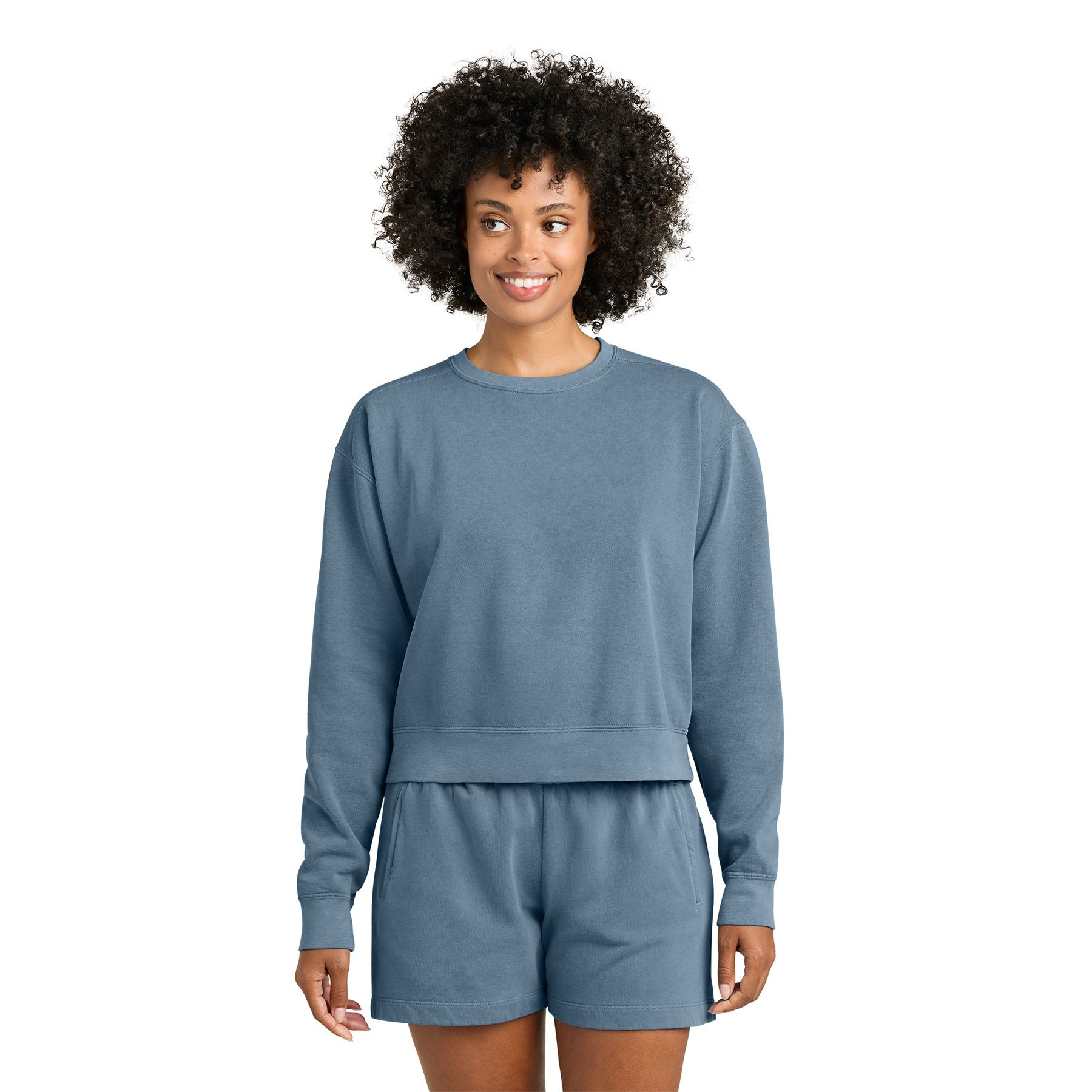 Blue Jean women's garment-dyed crewneck sweatshirt made from ring spun U.S. cotton and polyester fleece with a relaxed fit, rolled forward drop shoulders, rib knit cuffs, and waistband.