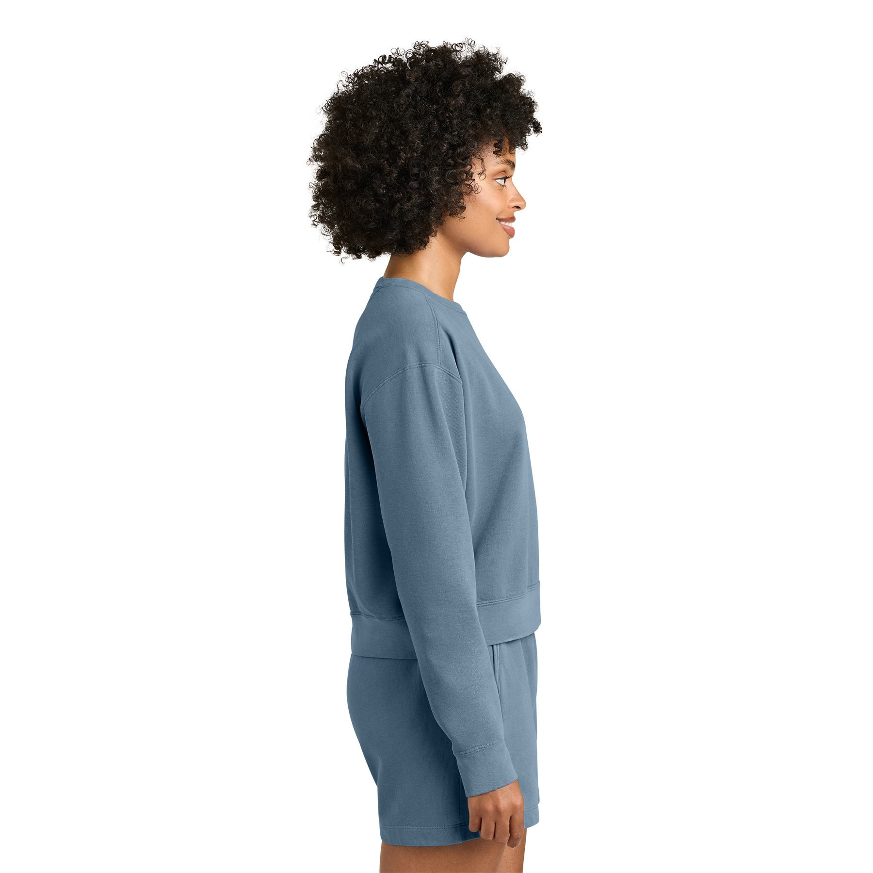Blue Jean women's garment-dyed crewneck sweatshirt made from ring spun U.S. cotton and polyester fleece with a relaxed fit, rolled forward drop shoulders, rib knit cuffs, and waistband.