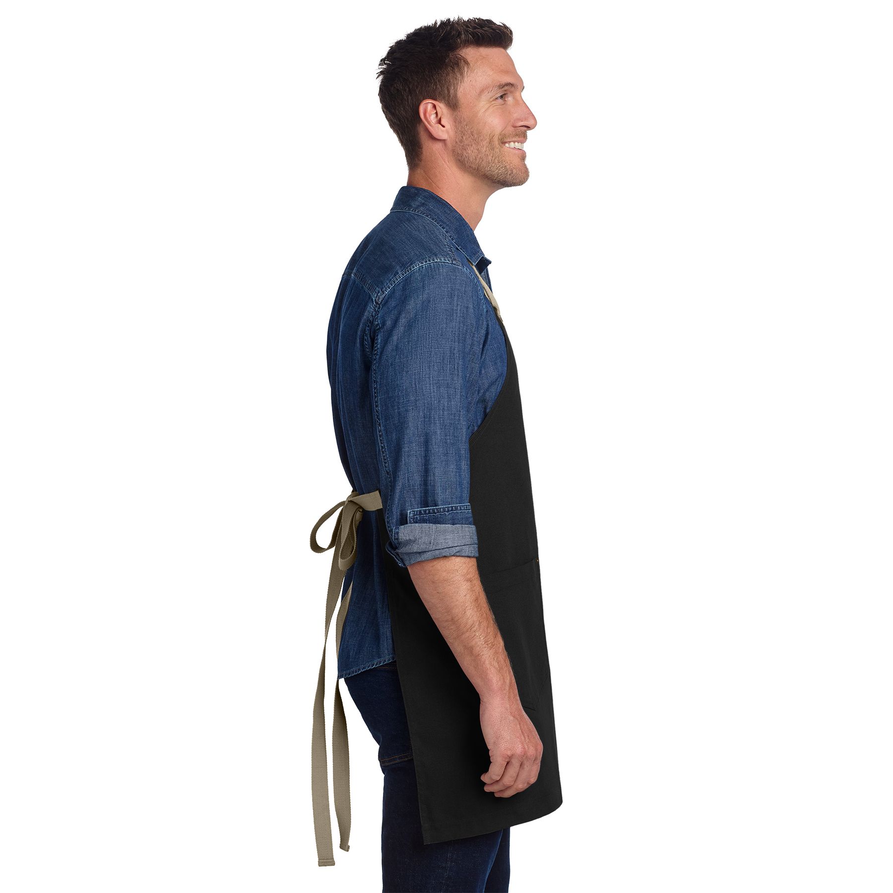 Black and stone full-length cotton canvas apron with adjustable neck strap, antique brass hardware, and two front patch pockets