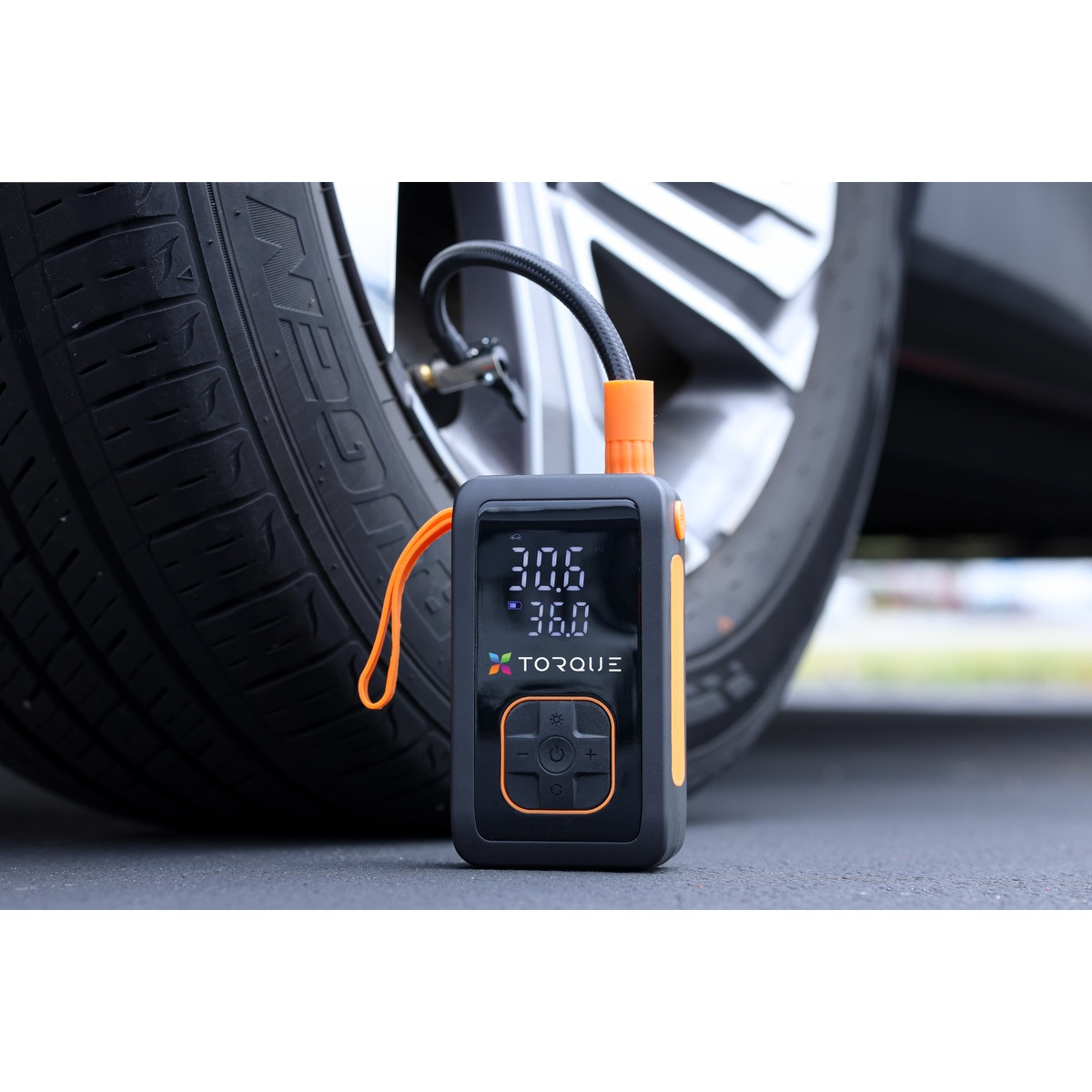 Black rechargeable tire inflator with built-in flashlight, digital controls, USB-C charging, and emergency power bank functionality.