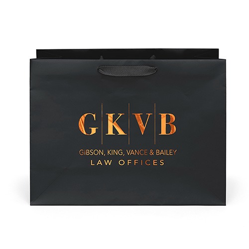 Black Rome Matte-Laminated Paper Gift Bag in black with premium matte-laminated paper, matching woven rope handles, reinforced fold-over top, and a cardboard bottom insert for elegant gift packaging and retail presentation.