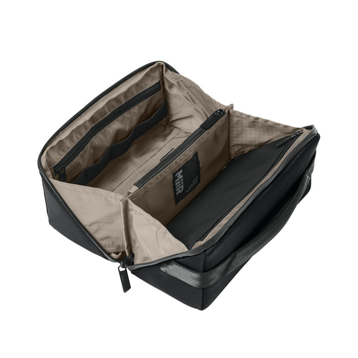 Pitch Black MiiR® Causeway Travel Organizer with a recycled polyester exterior, full-zip clamshell opening, multiple zippered and stretch organizer pockets, padded carry handle, and a compact design for organizing travel essentials, toiletries, and accessories.