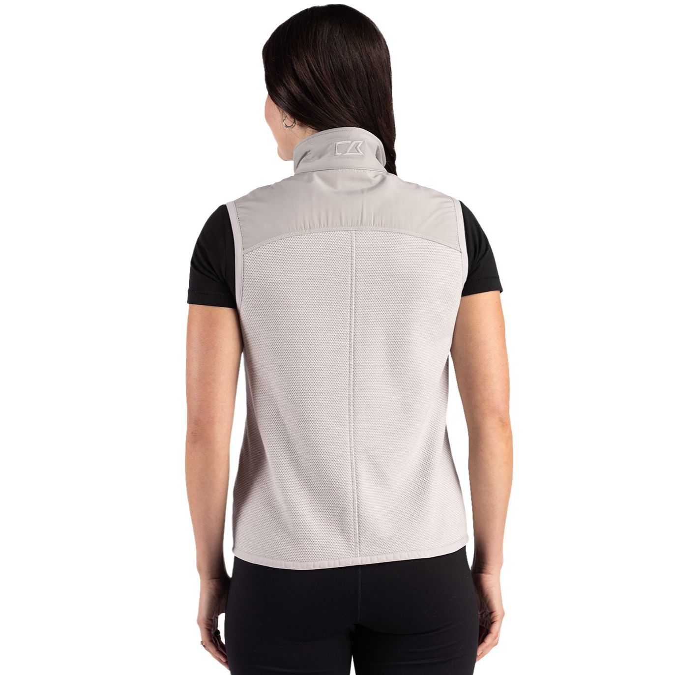 Polished Cutter & Buck women's recycled fleece full-zip vest featuring a jacquard textured finish, mock neck, and zip pockets made from recycled polyester.