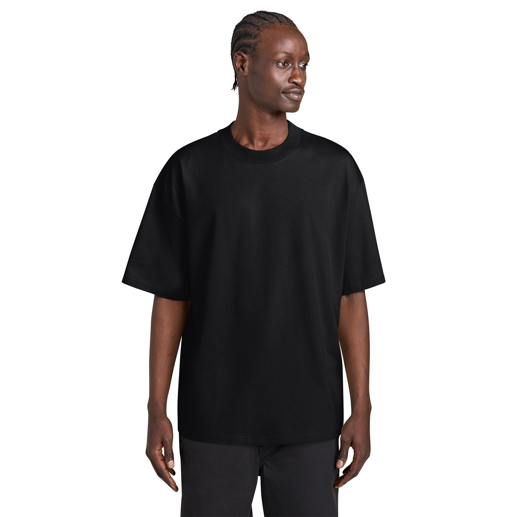Black oversized tee made from organic combed ring spun cotton with a mock neck, dropped shoulders, side-seamed construction, and double-needle topstitched sleeves and hem.