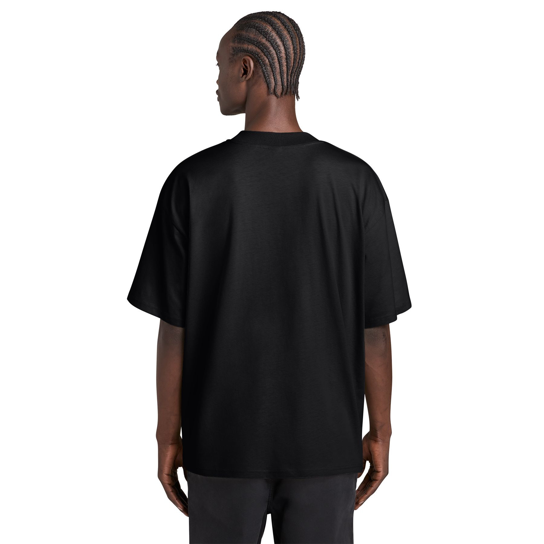 Black oversized tee made from organic combed ring spun cotton with a mock neck, dropped shoulders, side-seamed construction, and double-needle topstitched sleeves and hem.