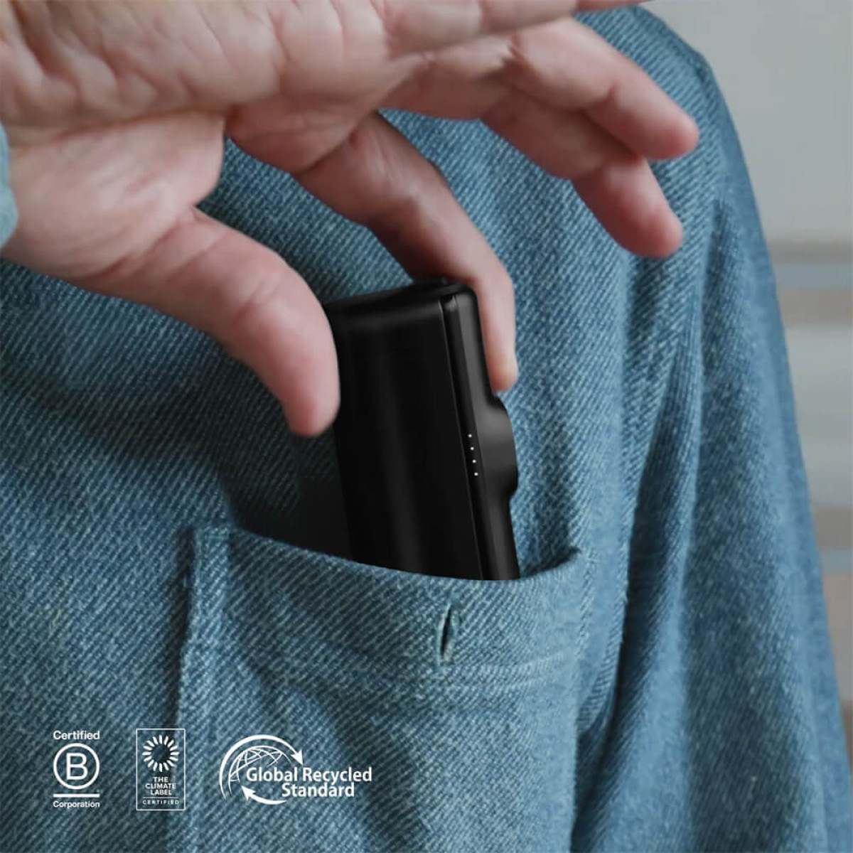 Black Nimble Bump Portable Charger, compact portable power bank with a foldable built-in USB-C connector, USB-C charging port, and rounded rectangular design for fast charging smartphones and USB-C devices on the go.