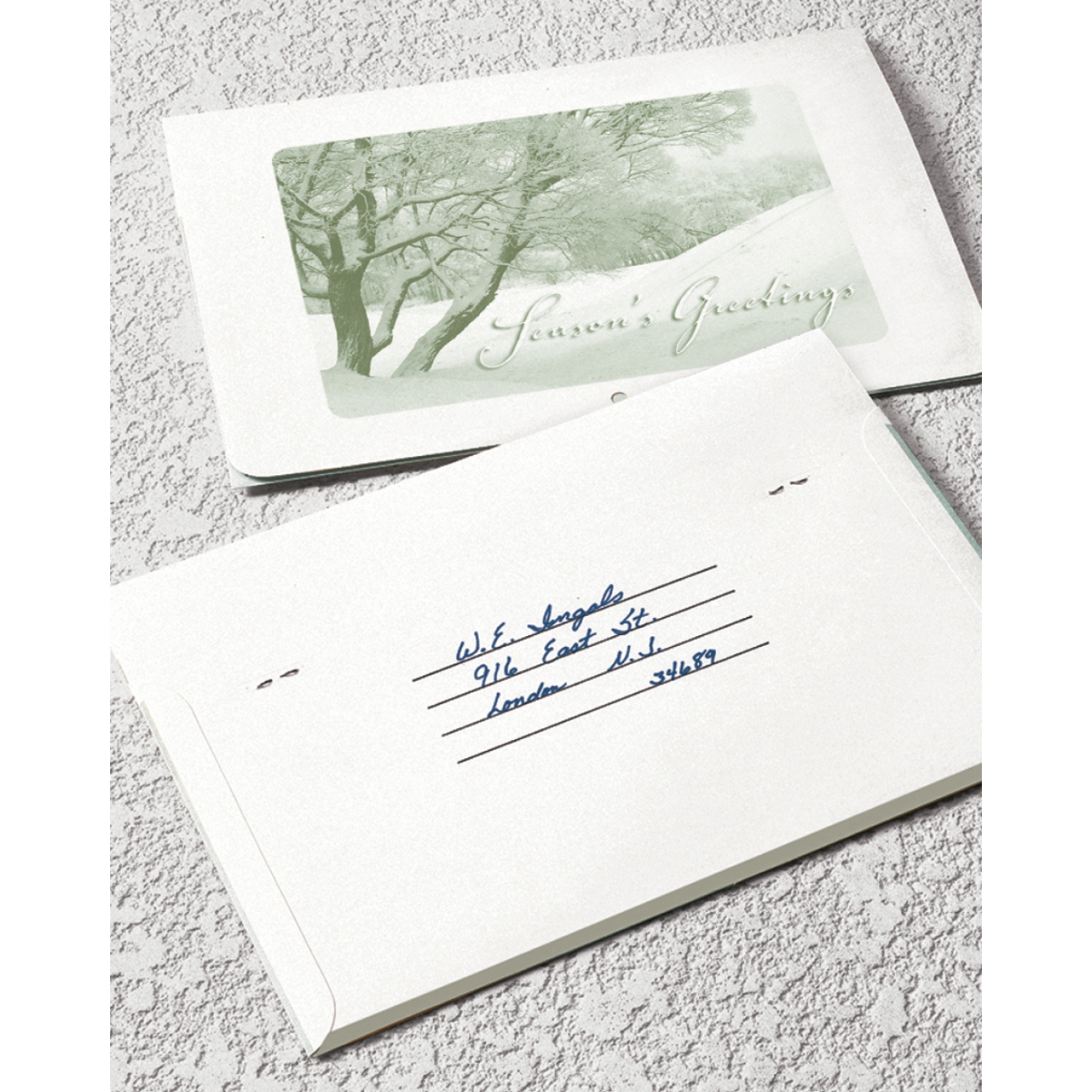 Versatile foldable calendar with a single storage pocket, “Season’s Greetings” cover, and self-mailer design, assembled in the USA.