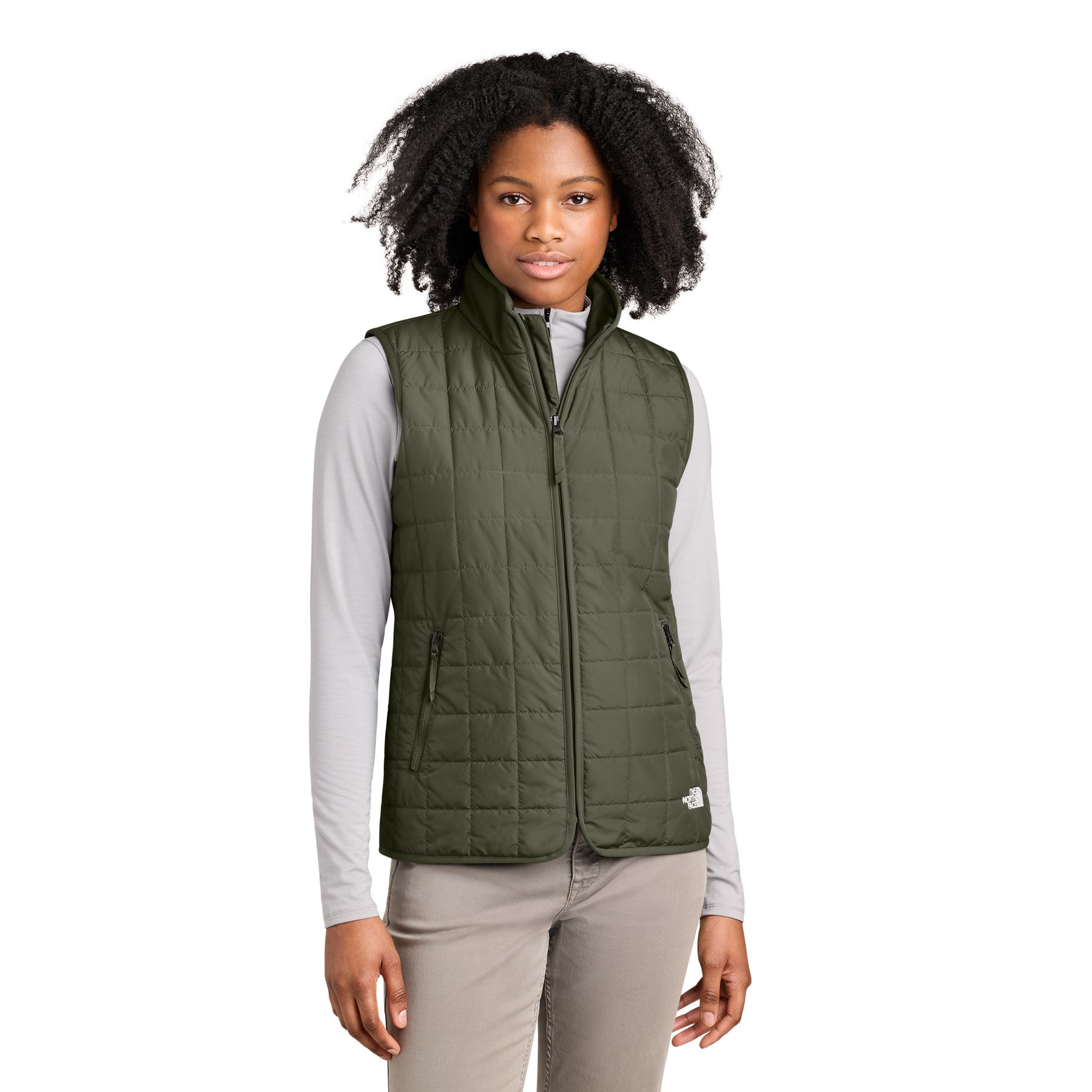 New Taupe Green The North Face® Women’s Iron Drift Quilted Vest a lightweight insulated quilted vest with a recycled polyester shell, non-PFC durable water-repellent finish, full-length reverse-coil zipper, stand collar, secure zippered hand pockets, stretch-bound armholes, and embroidered The North Face® logos, designed for lightweight warmth, layering, commuting, and everyday outdoor wear.