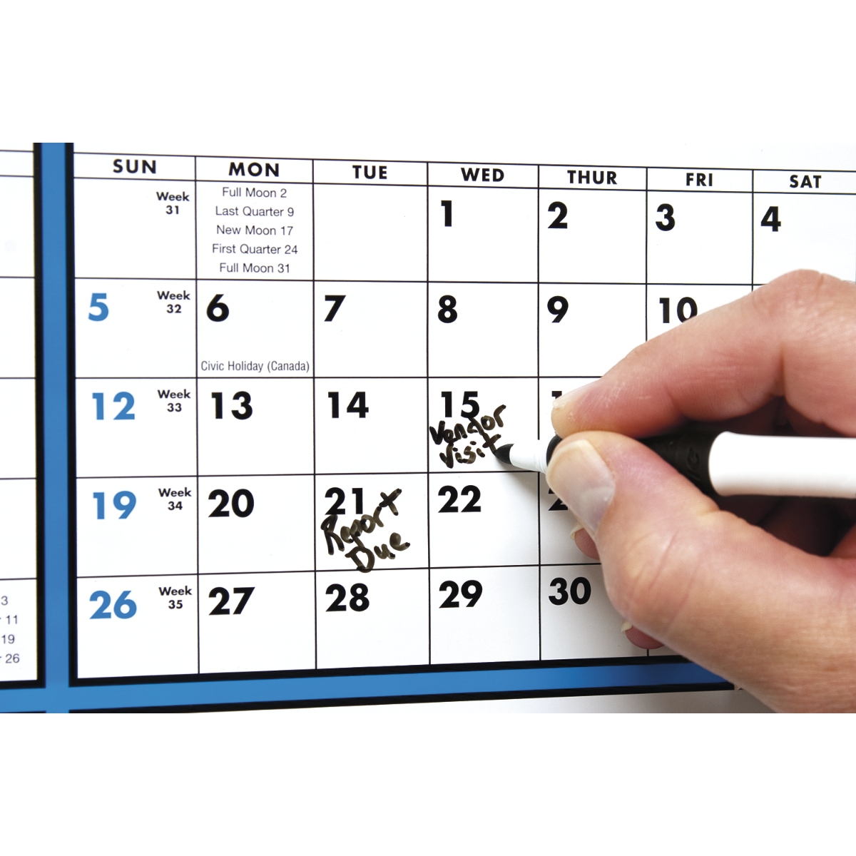 Span-A-Year Calendar (Laminated with Marker) featuring a full-year monthly grid on a white laminated paper surface with blue accents, tinned top and bottom edges, and a dry-erase marker for year-round planning and scheduling.