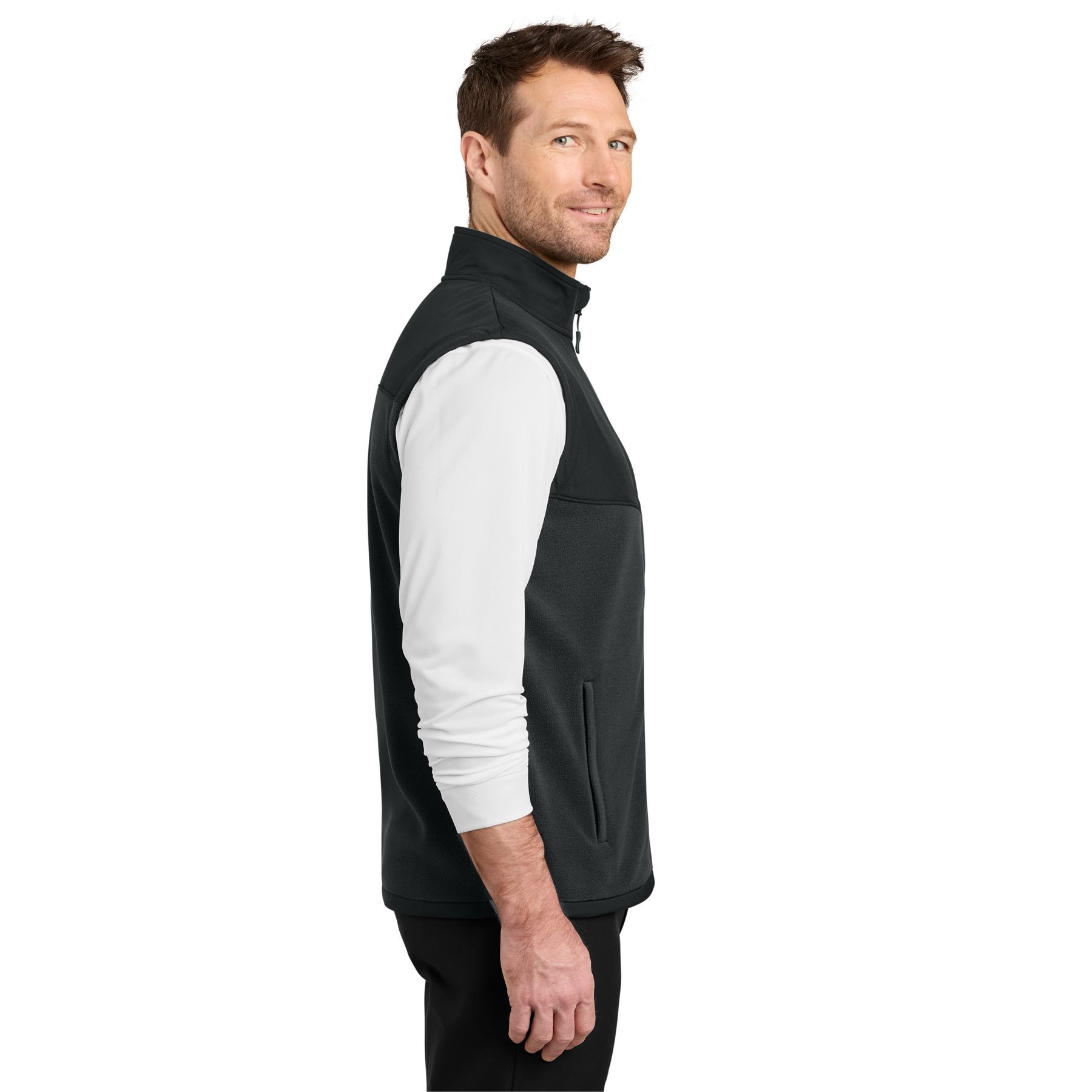 Black fleece vest with a zip-through cadet collar, full-length zipper, zippered front pockets, stretch woven shoulder overlay, and adjustable drawcord hem.